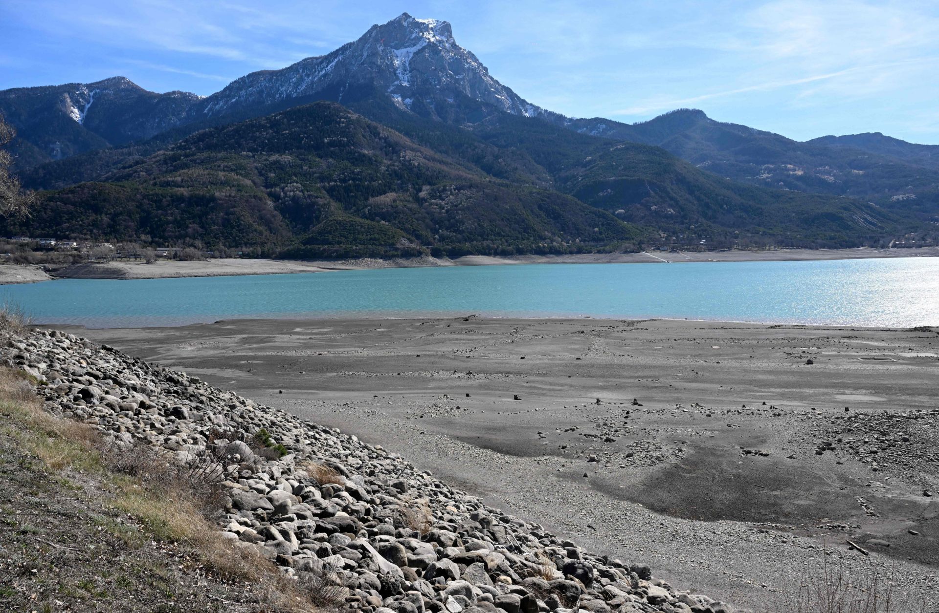 A photograph taken on March 16, 2023, shows Lake Serre-Poncon partially dry, near Embrun, in the French Alps. 
