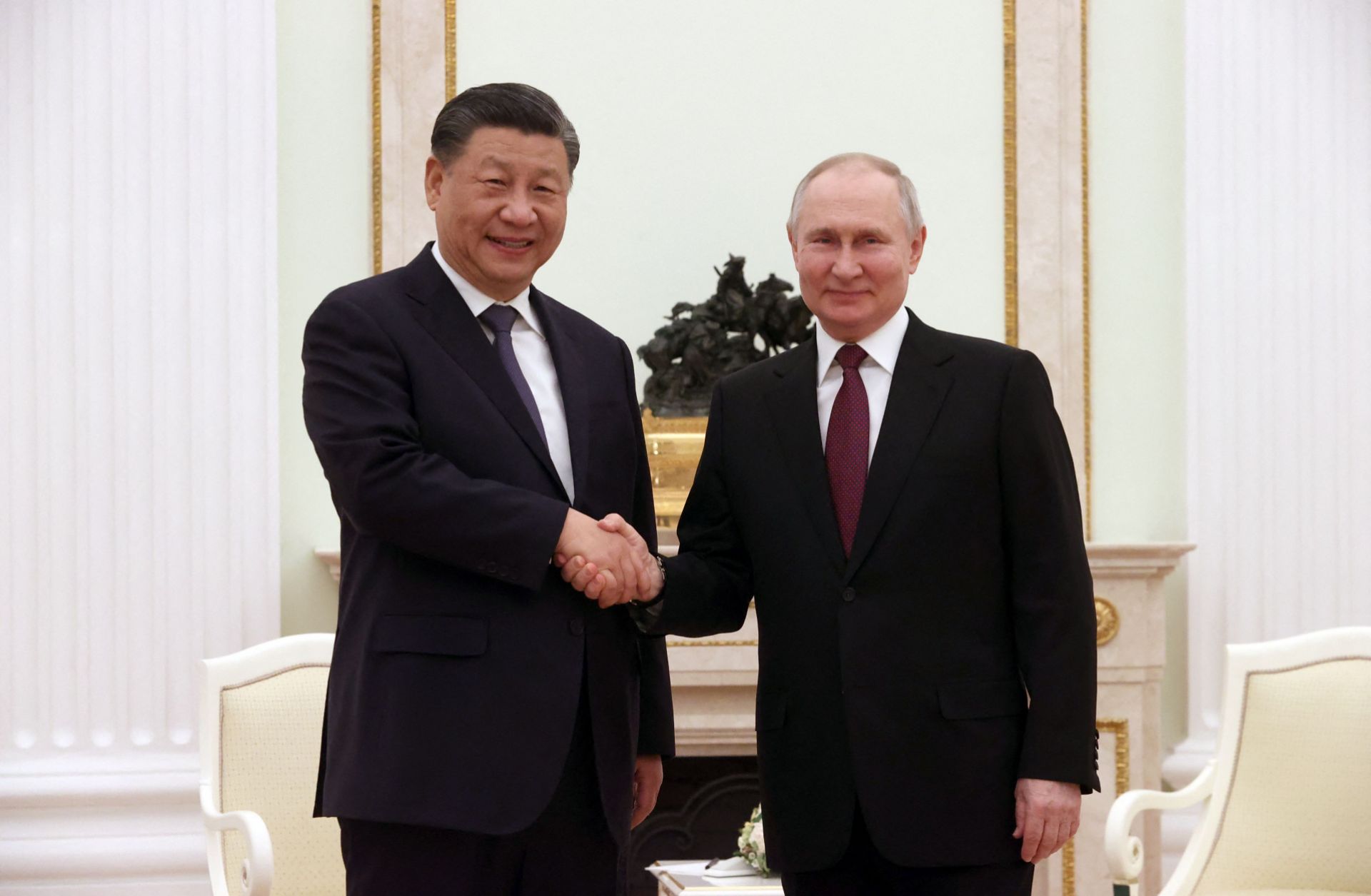 Russian President Vladimir Putin (right) meets with Chinese President Xi Jinping at the Kremlin in Moscow on March 20, 2023. 
