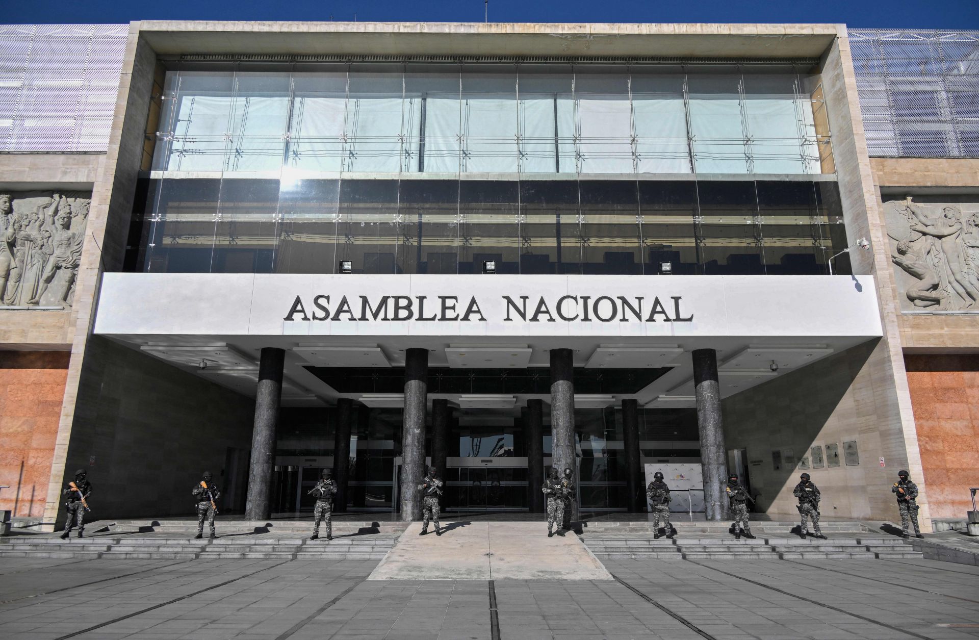 Police forces stand guard outside Ecuador's National Assembly in Quito after the country's president issued a decree dissolving the legislature on May 17, 2023. 