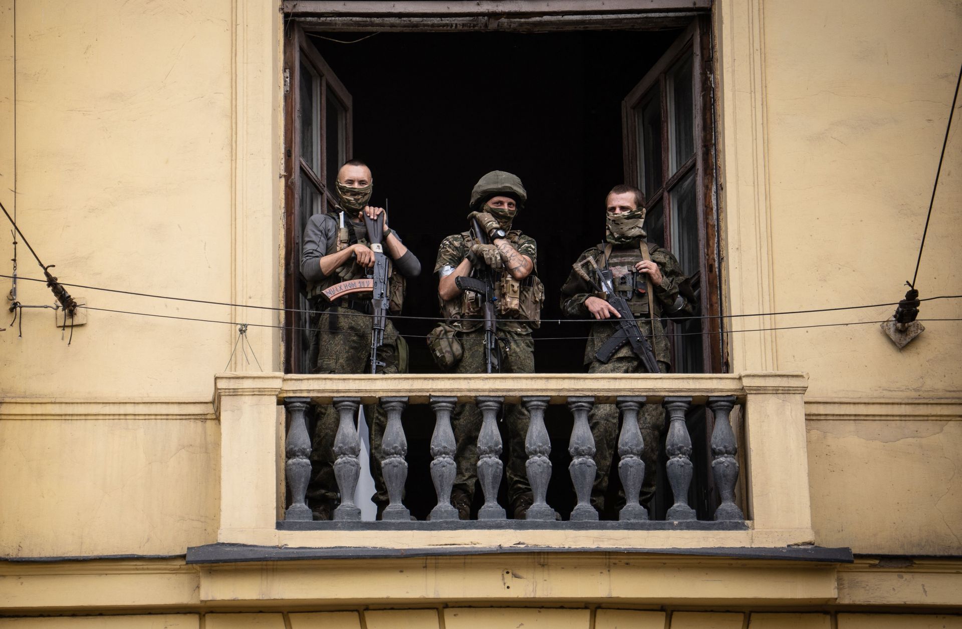Wagner mercenaries stand on the balcony of a building in the Russian city of Rostov-on-Don on June 24, 2023. 