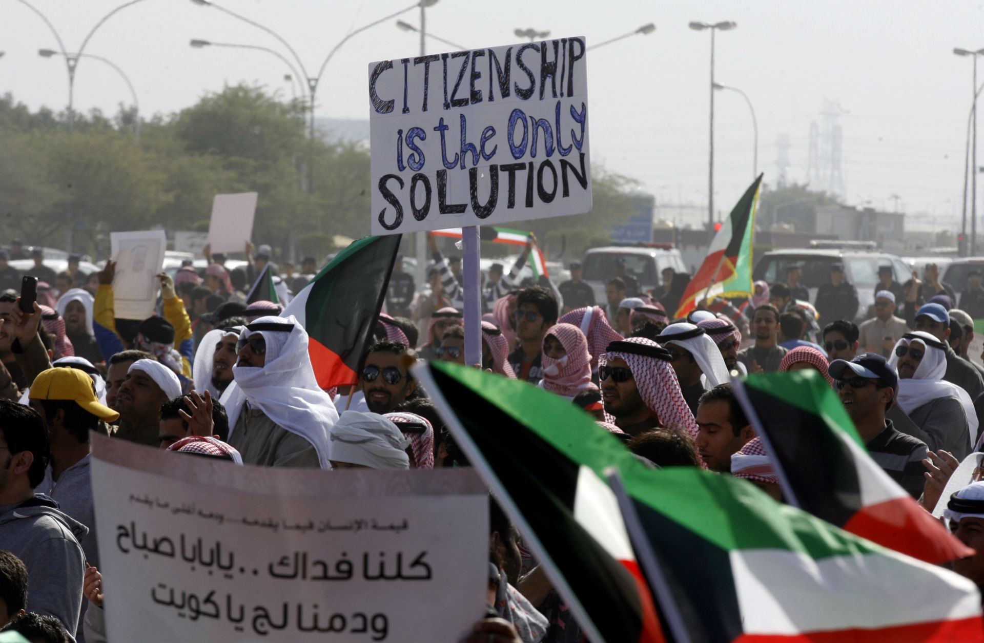 Members of Kuwait’s stateless Bidoon community protest to demand citizenship and other rights in Jahra, northwest of Kuwait City, in December 2011. 