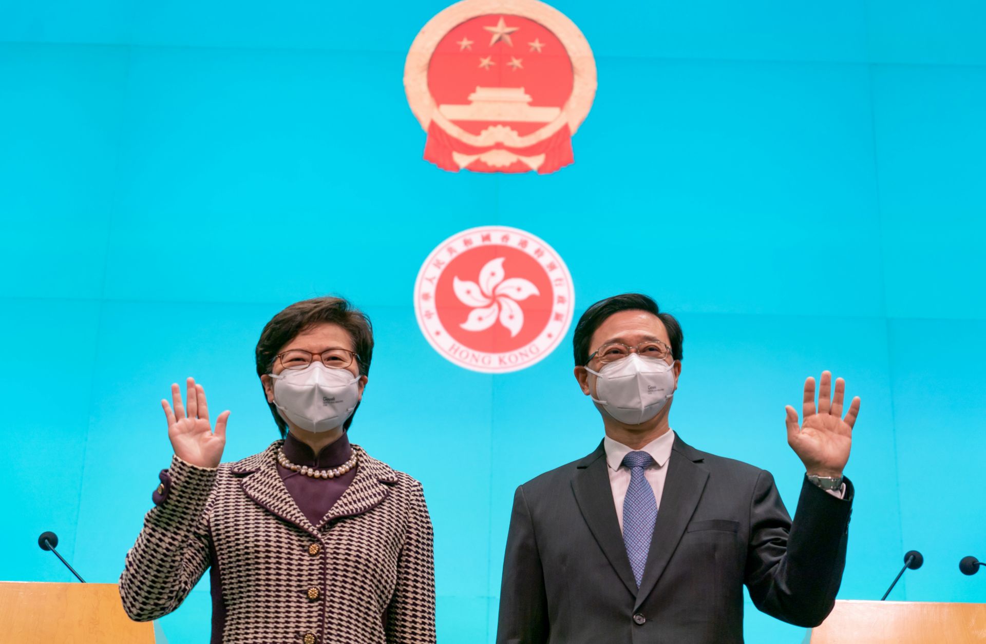 Hong Kong Chief Executive-elect John Lee (right) and current Chief Executive Carrie Lam attend a press conference at the Central Government Complex on May 9, 2022, in Hong Kong, China. 