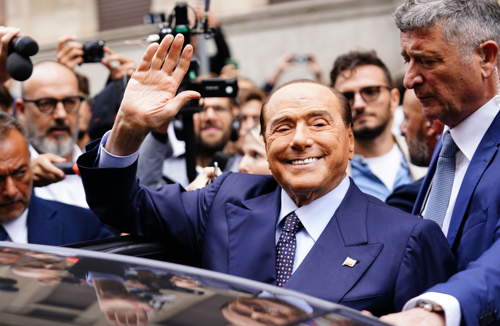 Silvio Berlusconi leaves a polling station after voting in Italy's September 2022 snap election. The former prime minister died on June 12, 2023, at the age of 86.