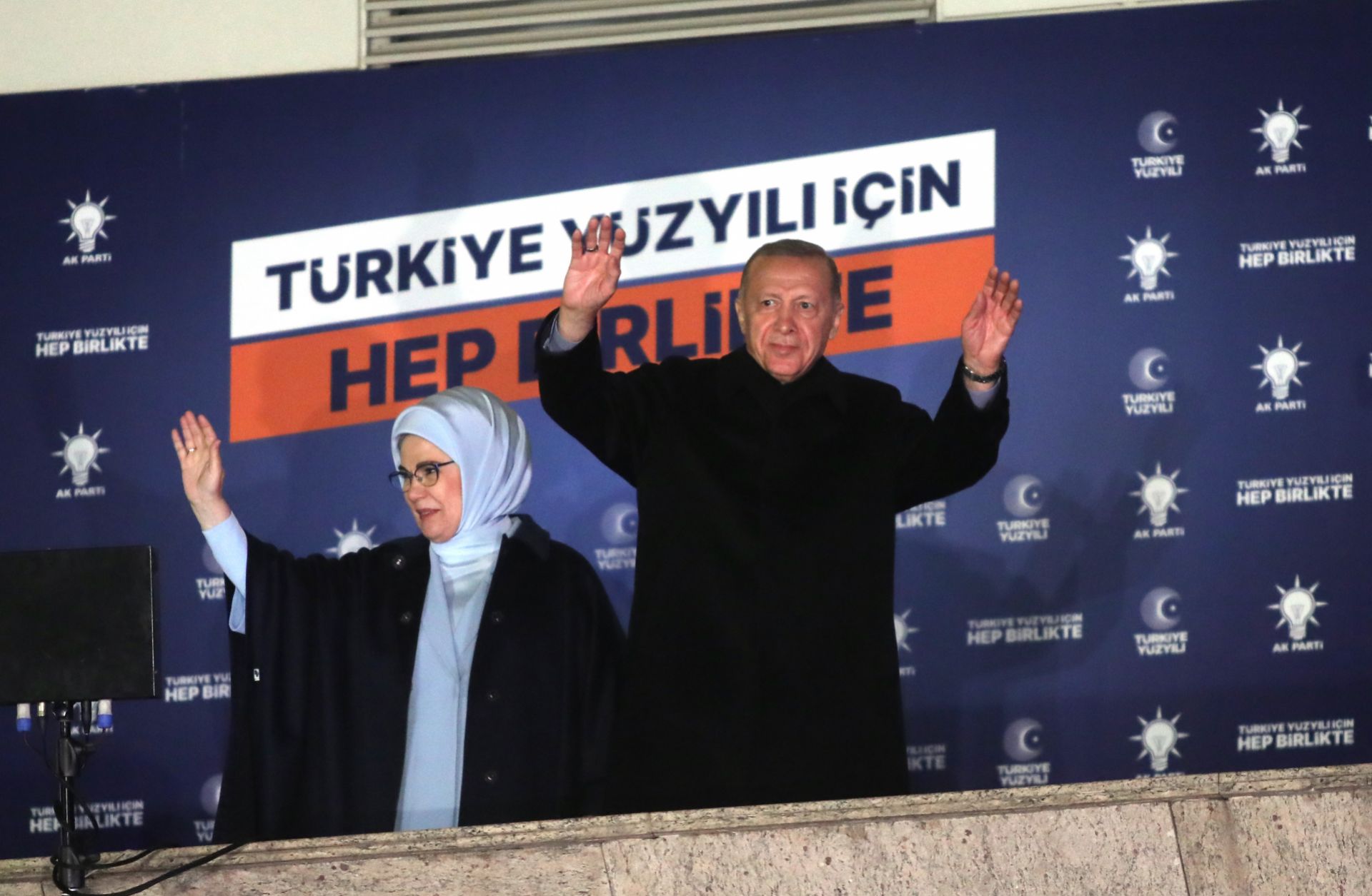 Turkish President Recep Tayyip Erdogan waves to his supporters from a balcony in Ankara, Turkey, on May 15, 2023. 