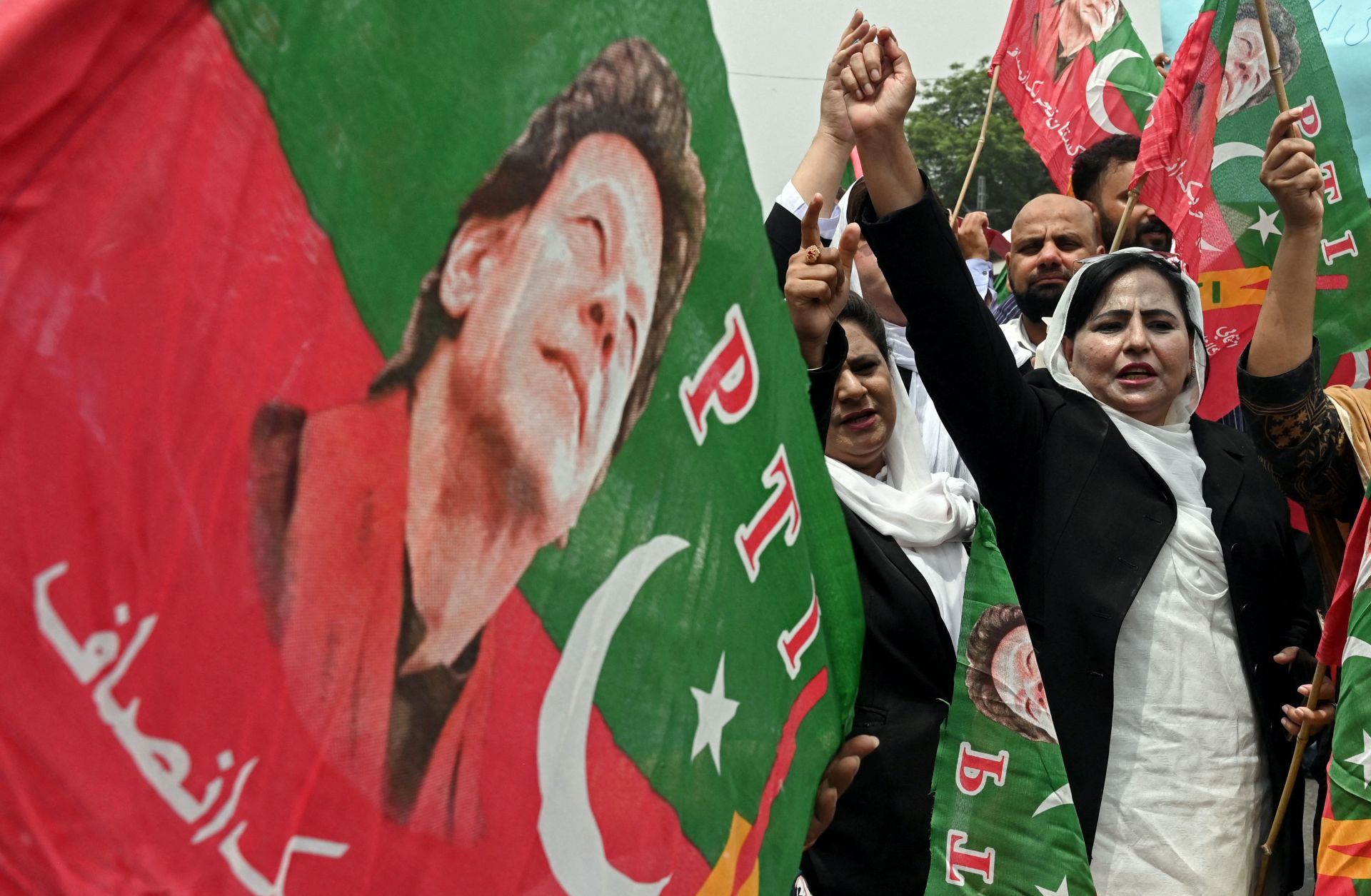 Supporters of former Pakistani Prime Minister Imran Khan denounce his arrest during a protest in Lahore on Aug. 7, 2023.