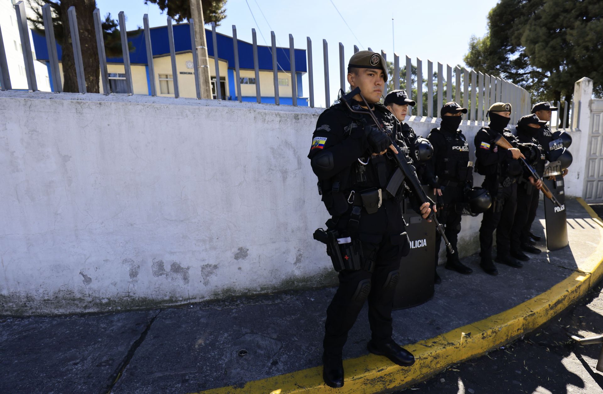 Police officers stand guard at the National Service of Legal Medicine and Forensic Science on Aug. 10, 2023, in Quito, Ecuador, following the assassination of a candidate running in the country's upcoming presidential election.