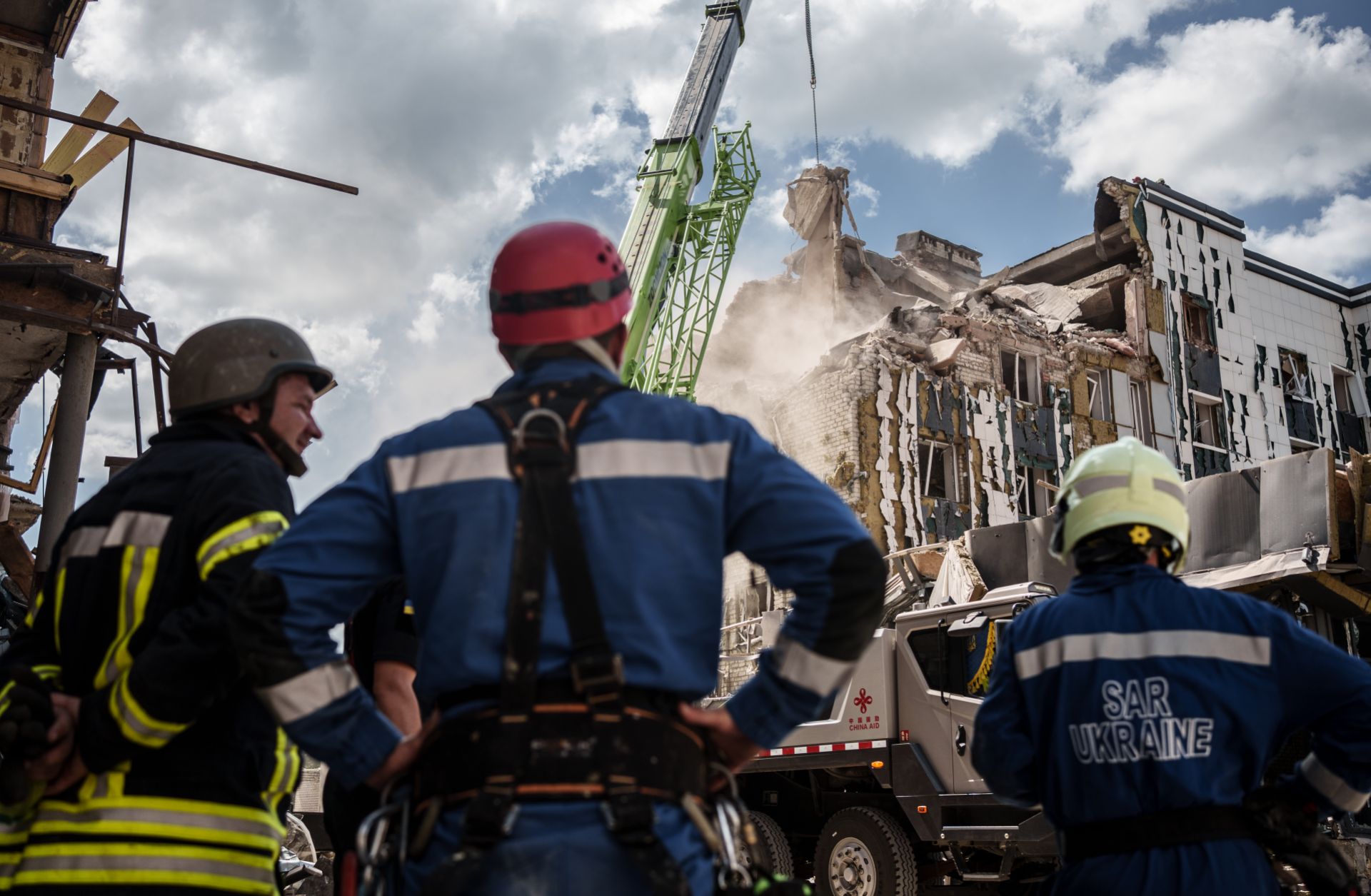Rescuers use a crane to dismantle the rubble of a building destroyed by a Russian shelling on Aug. 8, 2023, in Pokrovsk, Ukraine. 