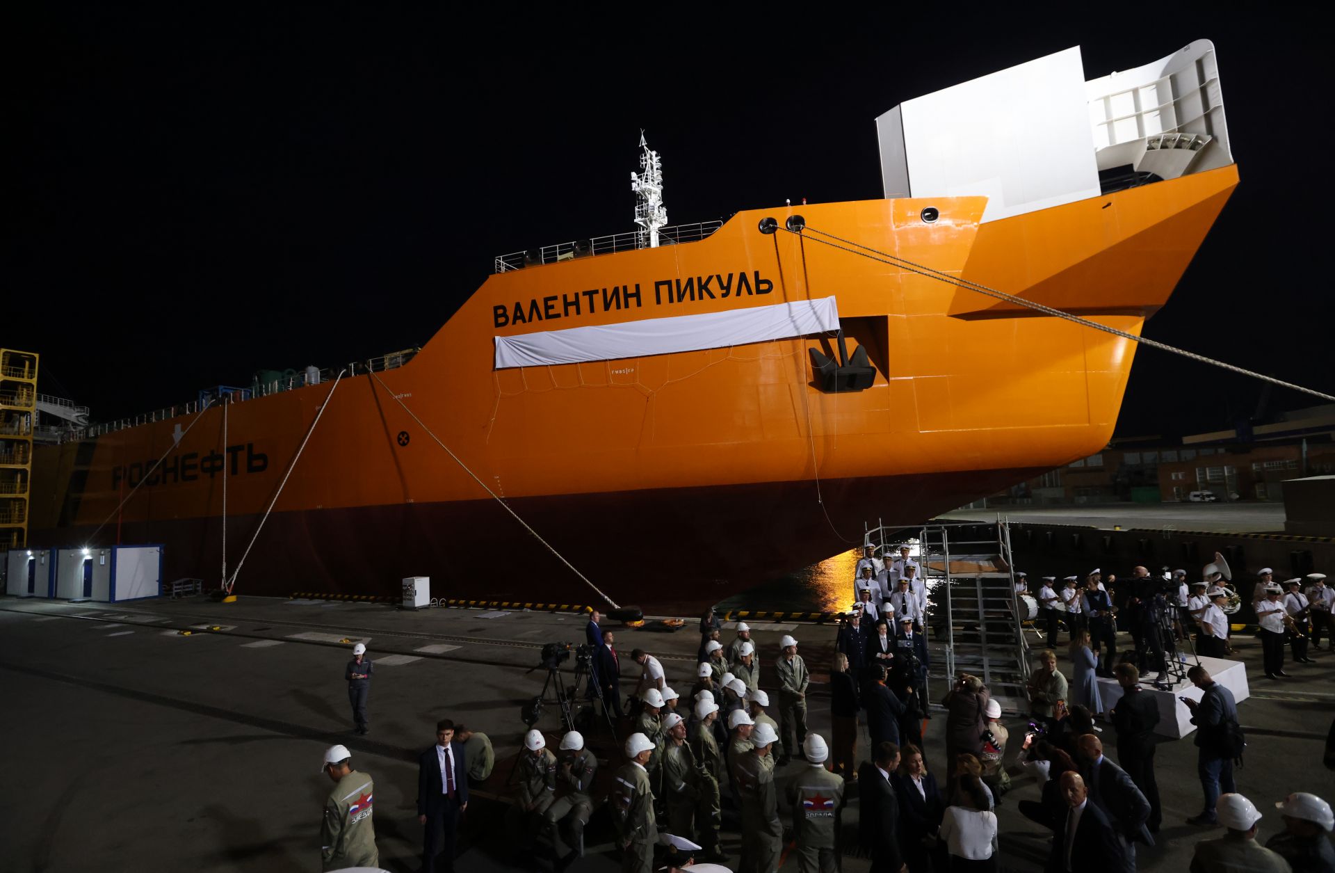 Guests attend a naming ceremony for the Valentin Pikul black class tanker of Russia's Rosneft oil company on Sept. 11, 2023, in Bolshoi Kamen, outside of Vladivostok, Russia. 