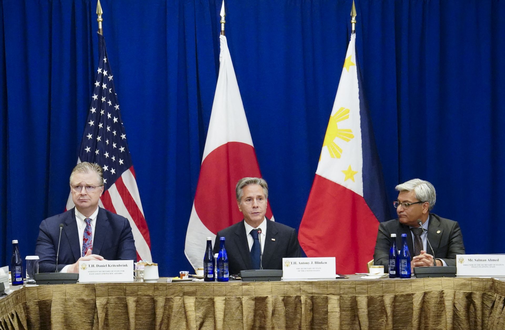 U.S. Secretary of State Antony Blinken (center), flanked by two other U.S. officials, is seen during a meeting with Japanese Foreign Minister Yoko Kamikawa and Philippine Foreign Minister Enrique Manalo (not pictured) on the sidelines of the 78th United Nations General Assembly at the Lotte Palace Hotel in New York City on Sept. 22, 2023.