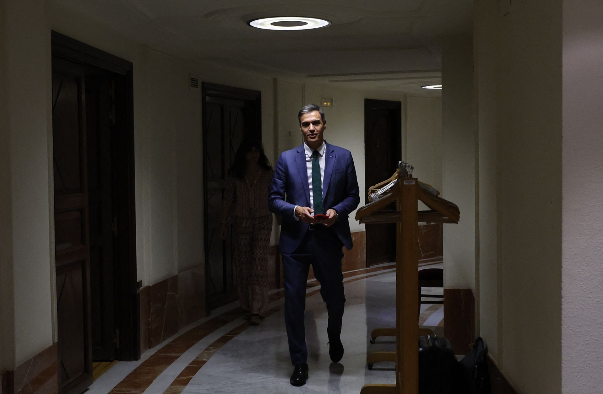 Acting Spanish Prime Minister Pedro Sanchez comes back to the chamber as he attends the first session of a parliamentary debate to vote through a prime minister in Madrid on Sept. 26, 2023. 