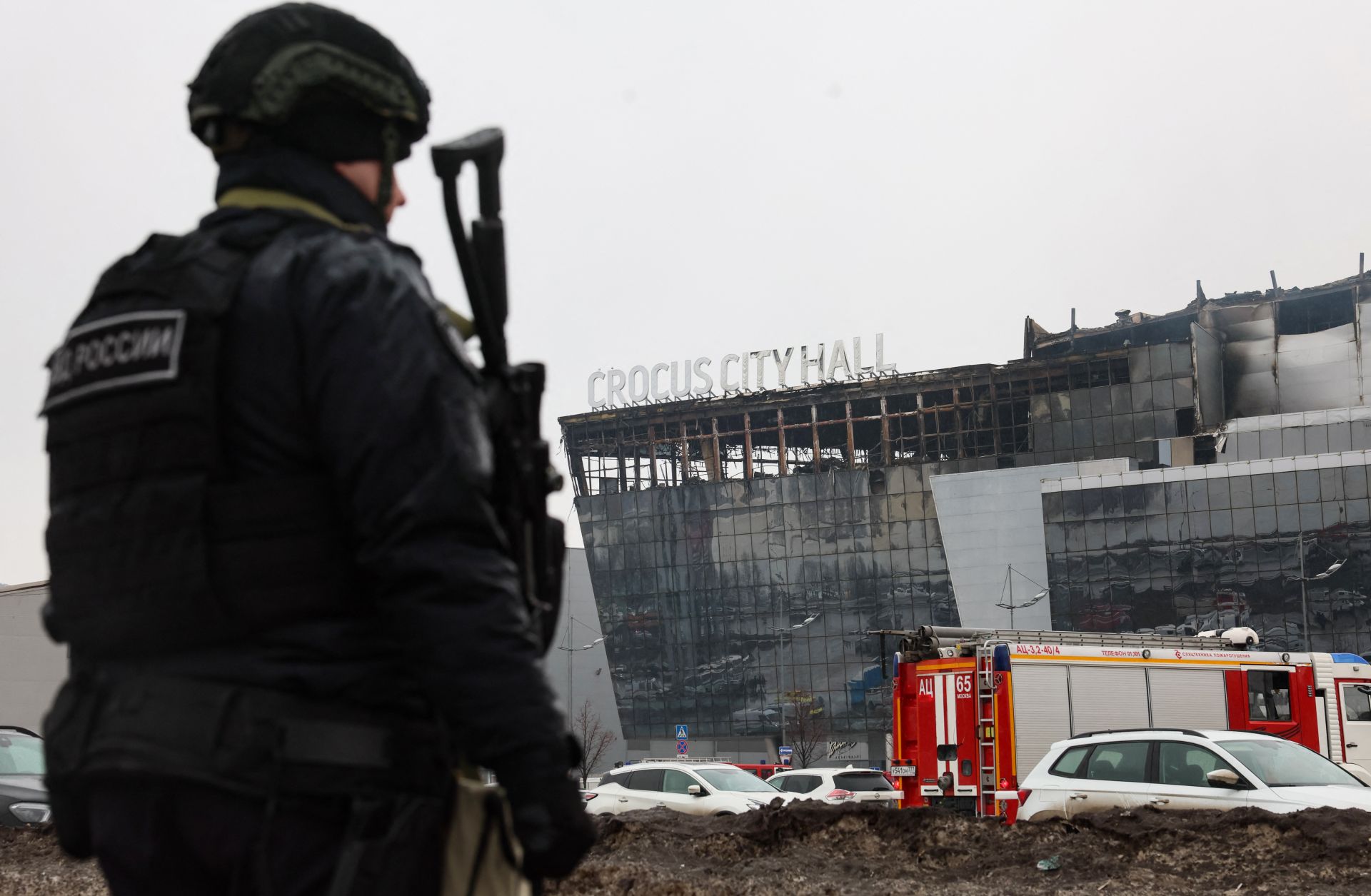 A law enforcement officer patrols the scene of the terrorist attack at the Crocus City Hall concert venue in Krasnogorsk, outside Moscow, on March 23, 2024. 