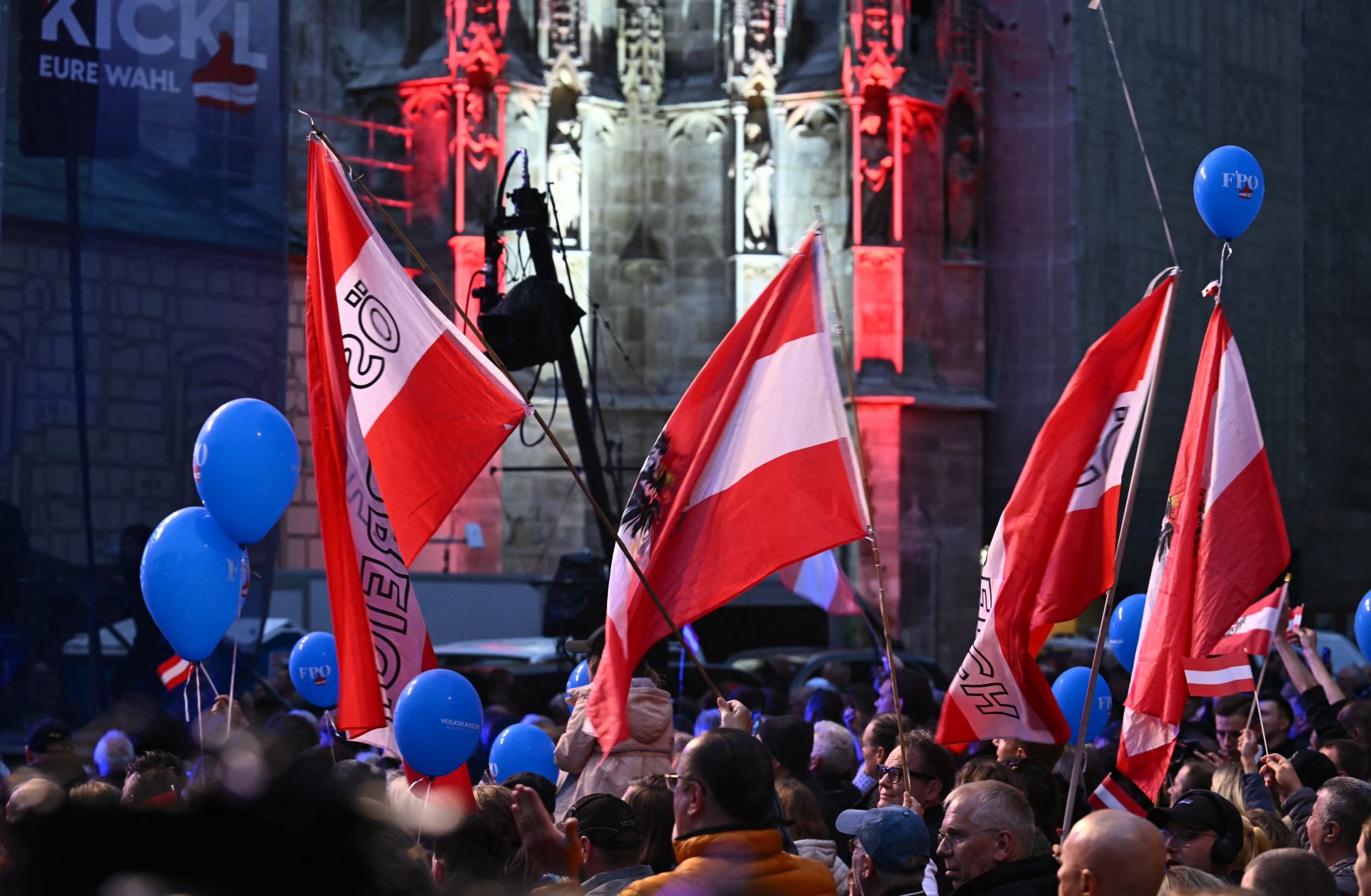 Supporters of the far-right Freedom Party of Austria (FPO) wave flags during an election rally in Vienna, Austria, on Sept. 27, 2024. 