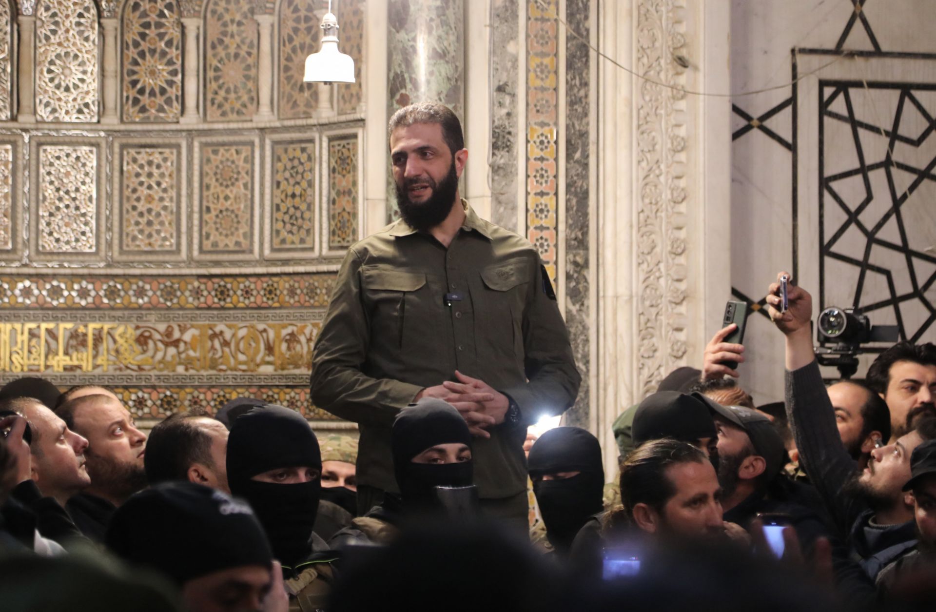 Syria’s de-facto leader Ahmad al-Sharaa addresses a crowd at a mosque in Damascus on Dec. 8, 2024.