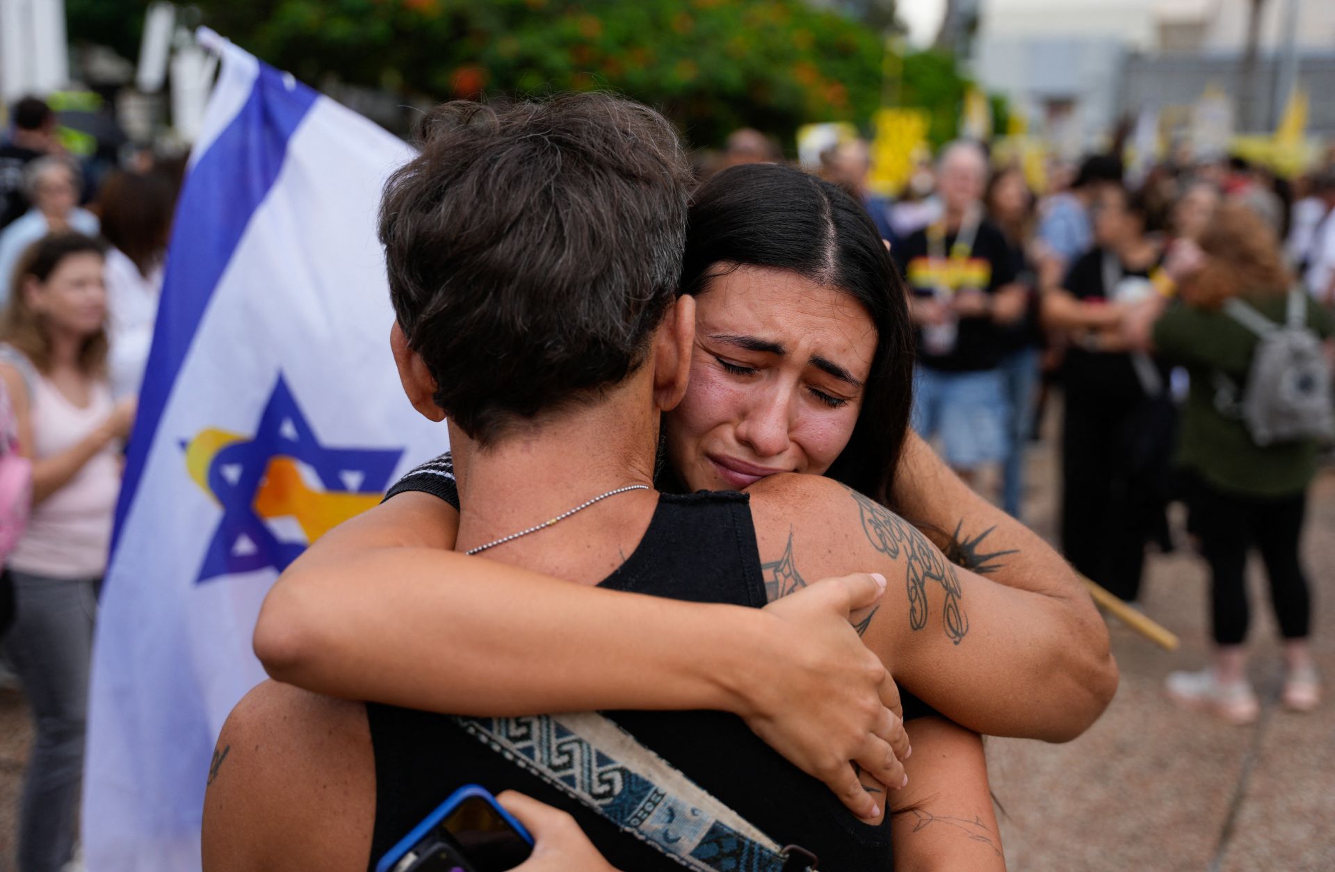 People react at Hostage Square in Tel Aviv on Oct. 9, 2025, following news of a new Gaza ceasefire deal.