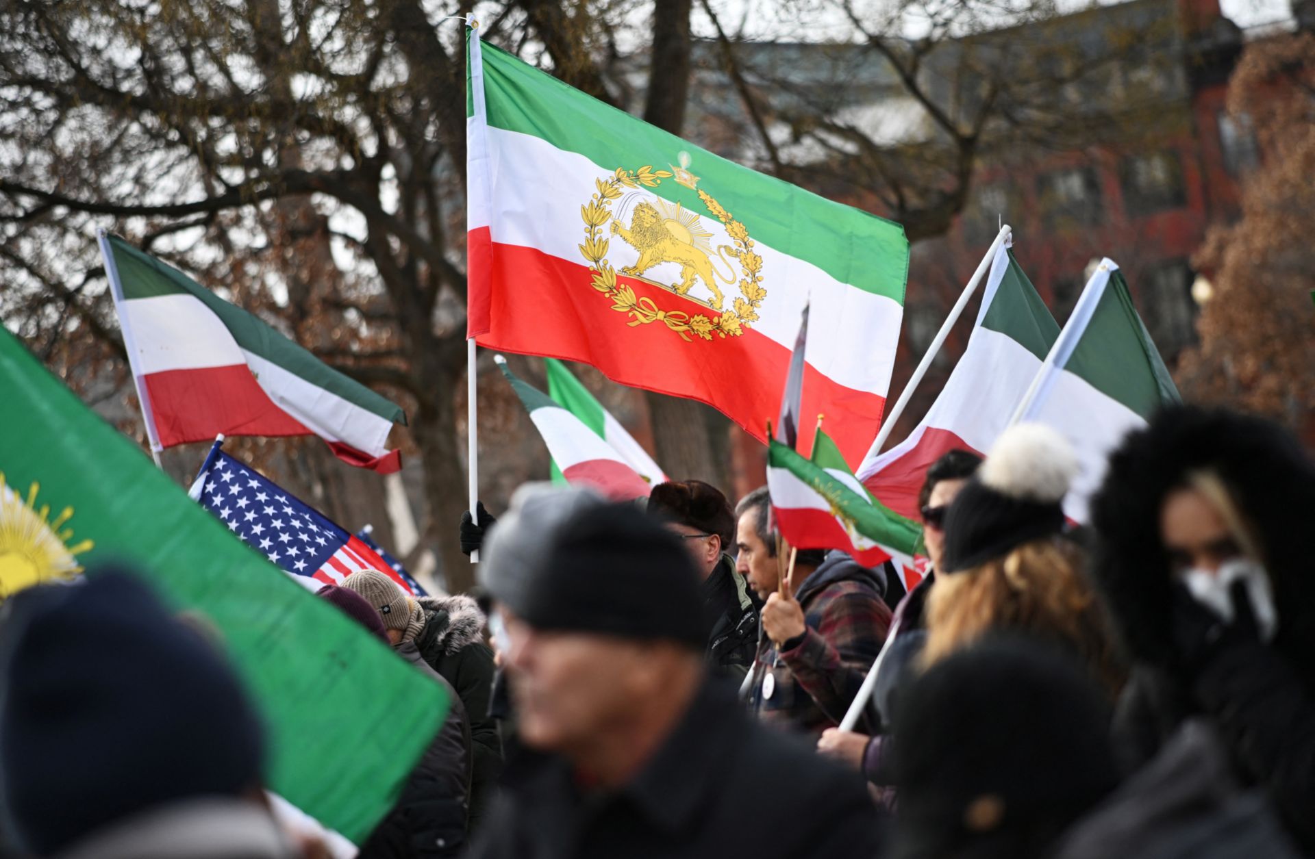 Activists hold Iranian flags in support of the ongoing protests in Iran during a rally in Washington, D.C., on Jan. 3, 2026.