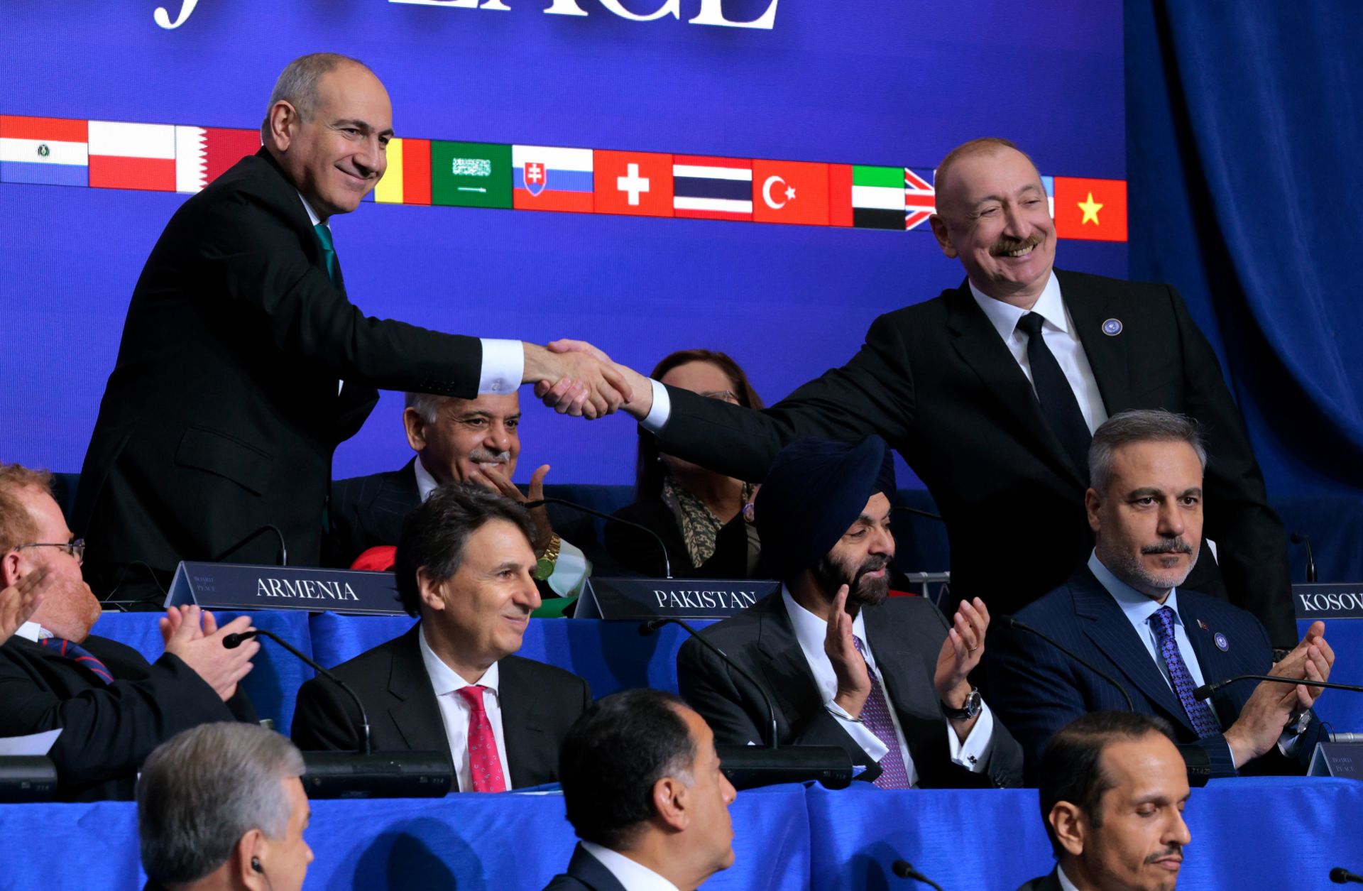 Armenian Prime Minister Nikol Pashinyan (left) shakes hands with Azerbaijani President Ilham Aliyev during the inaugural meeting of the Board of Peace at the Donald J. Trump Institute of Peace on Feb. 19, 2026, in Washington, D.C.
