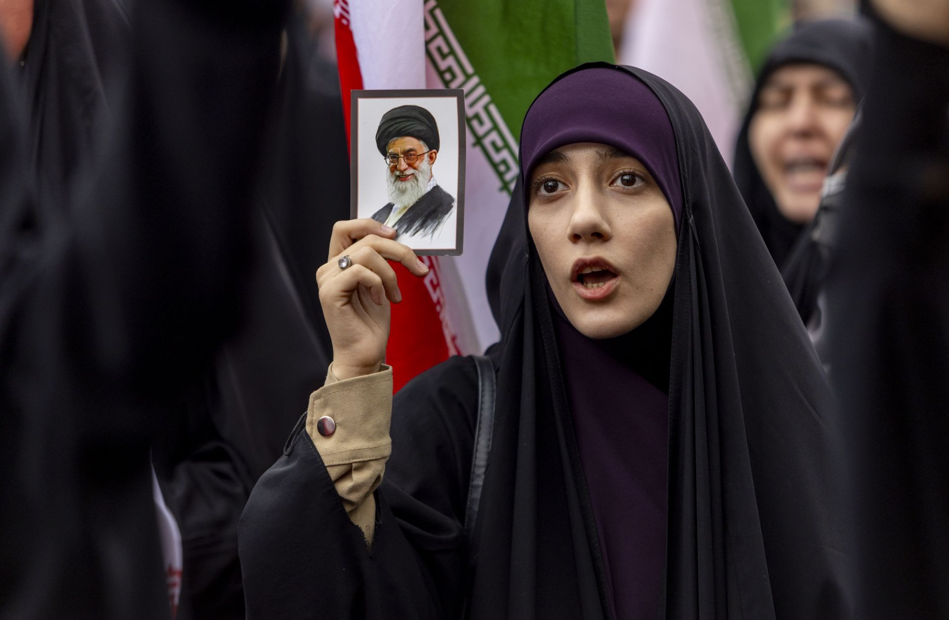 A woman holds a photo of Ayatollah Ali Khamenei as Iranians protest against attacks on Iran by Israel and the United States on Feb. 28, 2026 in Tehran, Iran. 