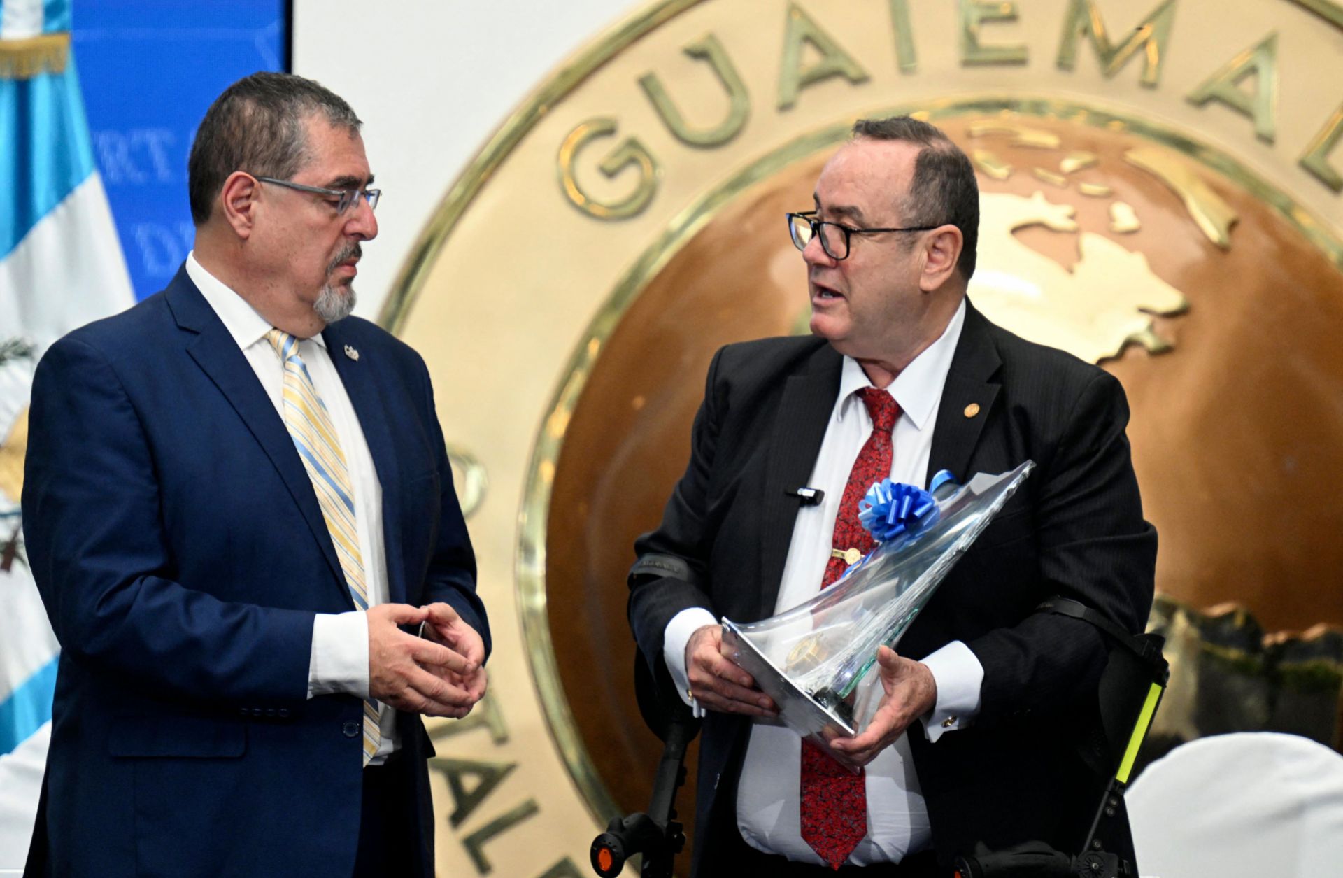 Guatemalan President-elect Bernardo Arevalo and Guatemalan outgoing President Alejandro Giammattei chat at the end of the second government transition meeting on Sept. 11, 2023. 