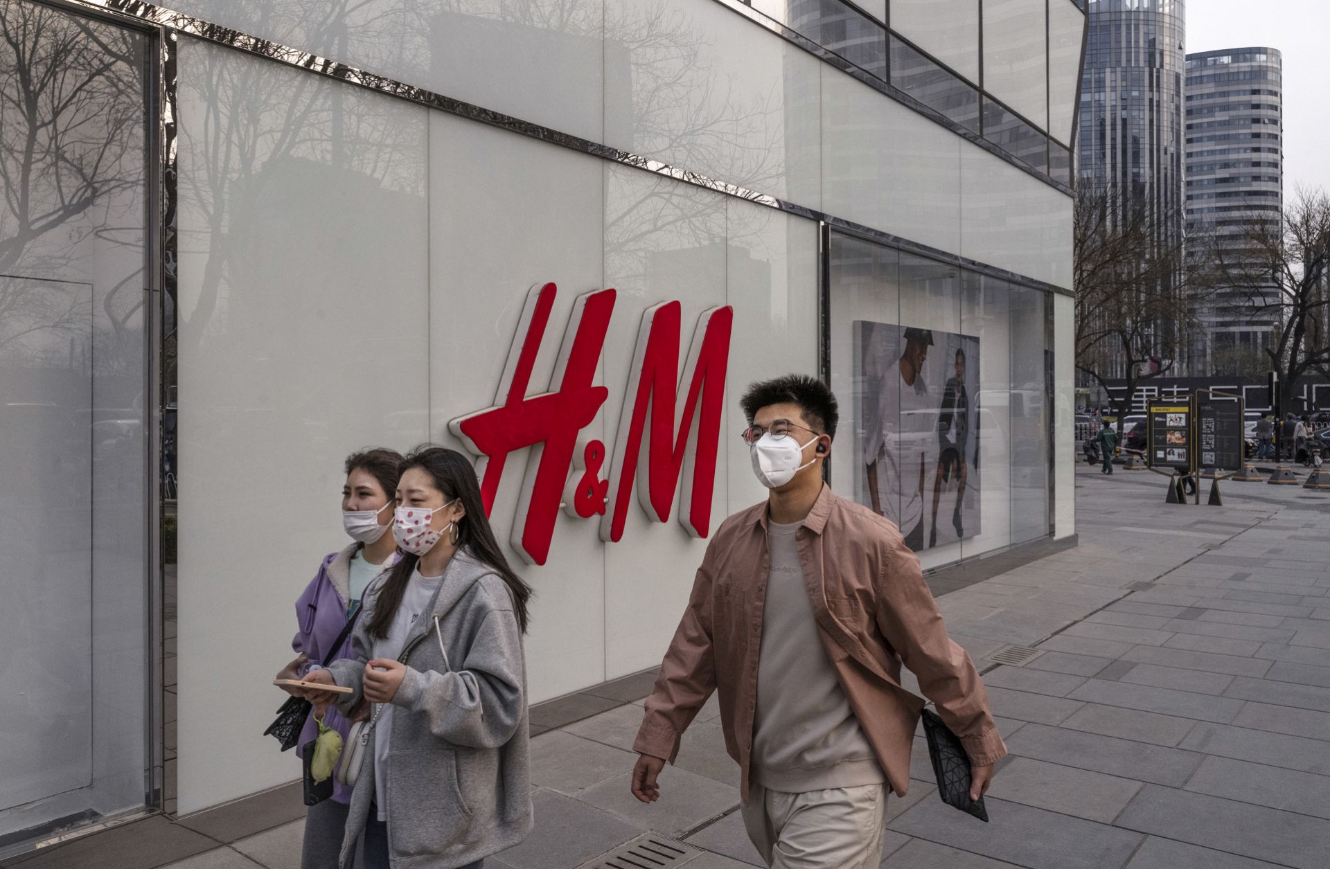 People walk past an H&M store in Beijing, China, on March 25, 2021. People walk past an H&M store in Beijing, China, on March 25, 2021.