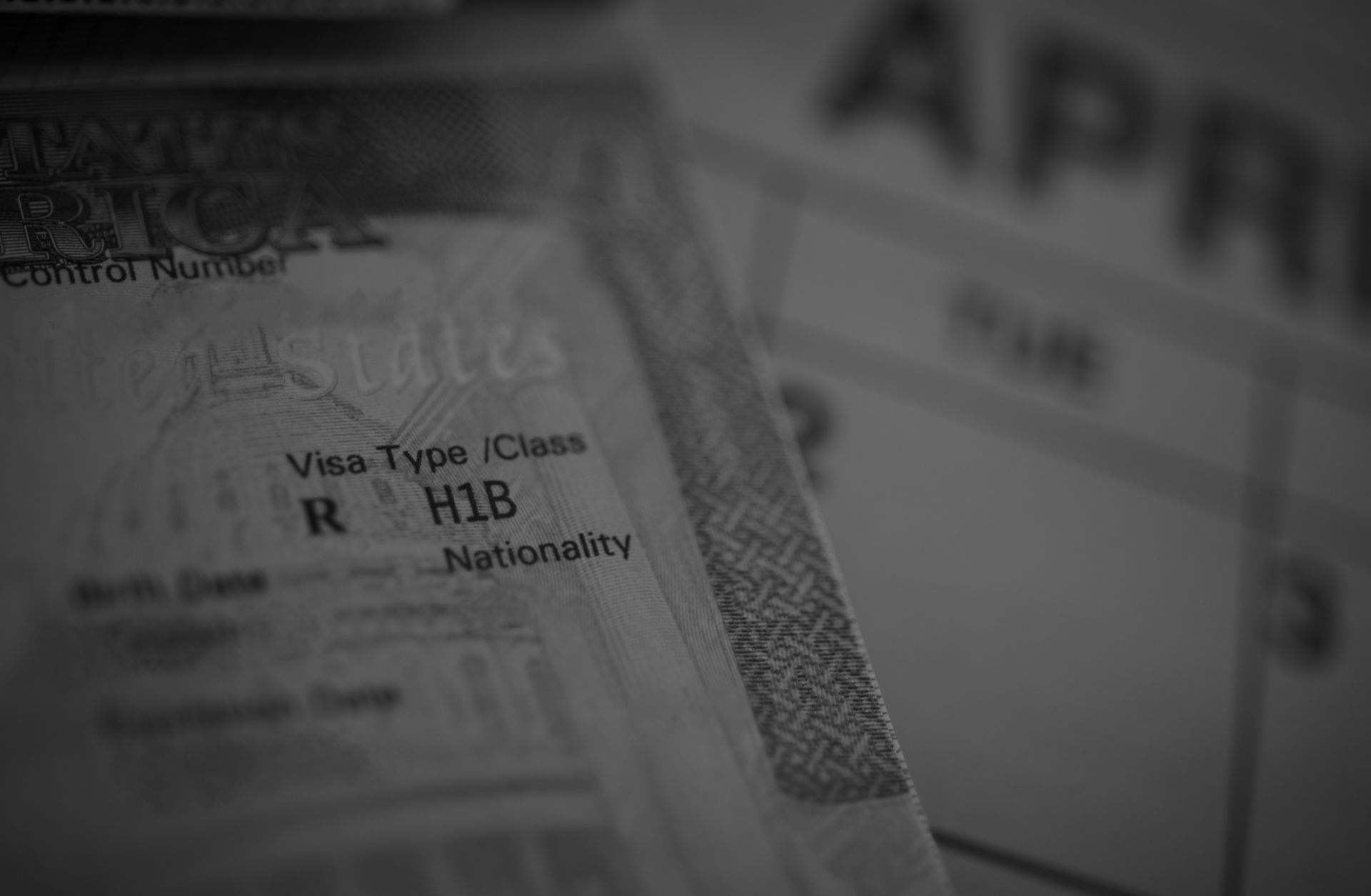 An H1B visa (for specialty workers) stamp is seen in a passport.
