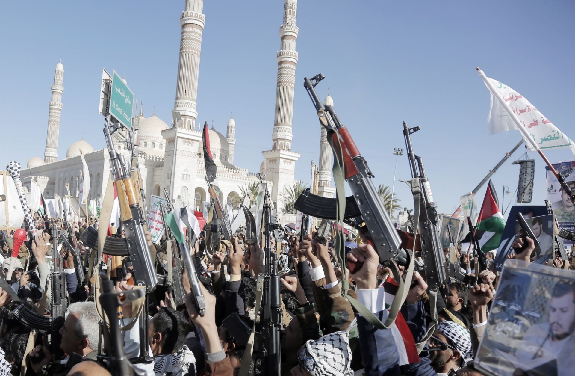 Supporters of Yemen's Houthi movement brandish weapons and chant slogans as they take part in a protest staged in solidarity with the Palestinian people in Gaza on Jan. 17, 2025, in Sanaa, Yemen. 