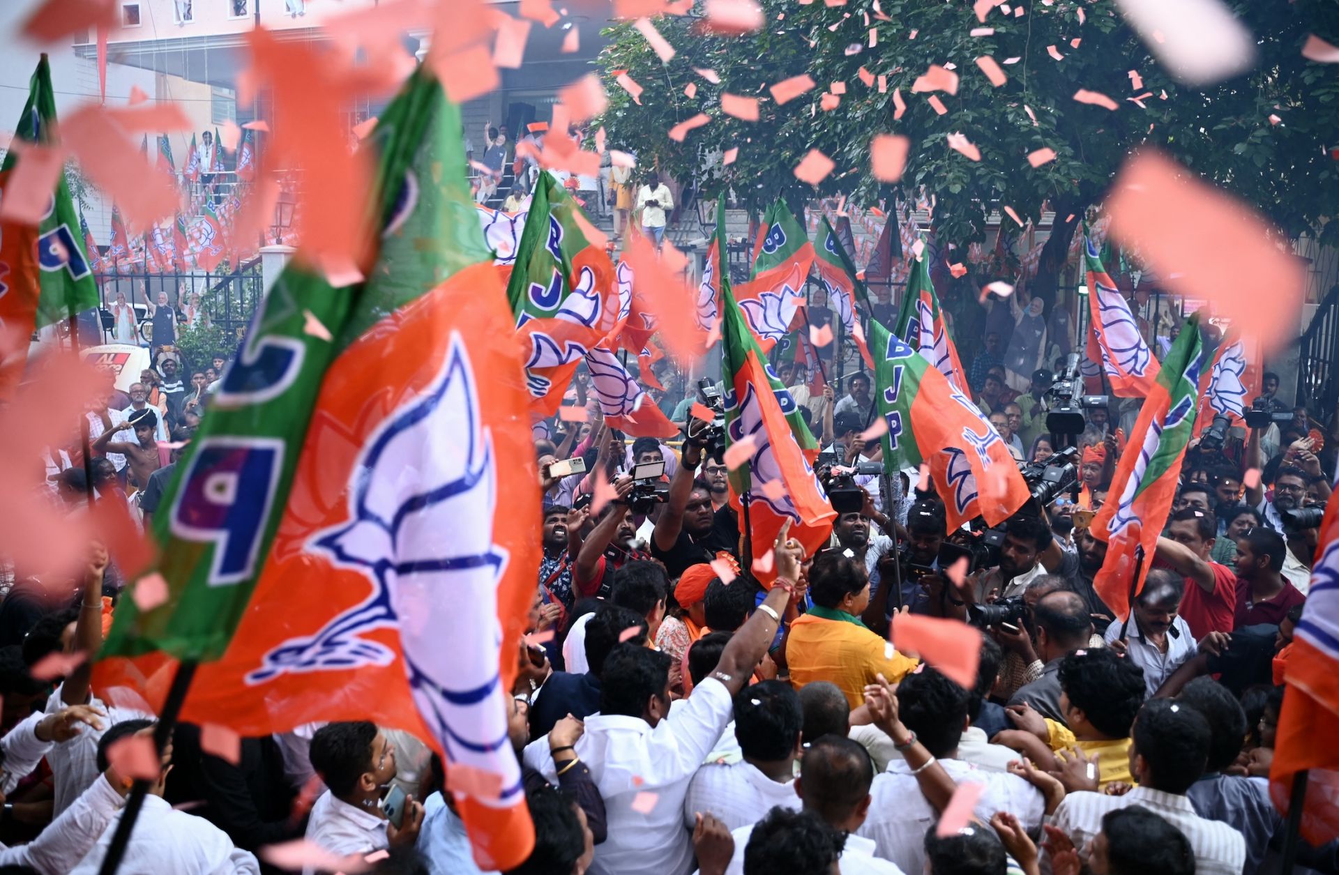 Supporters of Prime Minister Narendra Modi's Bharatiya Janata Party (BJP) celebrate vote counting results for India's general election in Bengaluru on June 4, 2024. 
