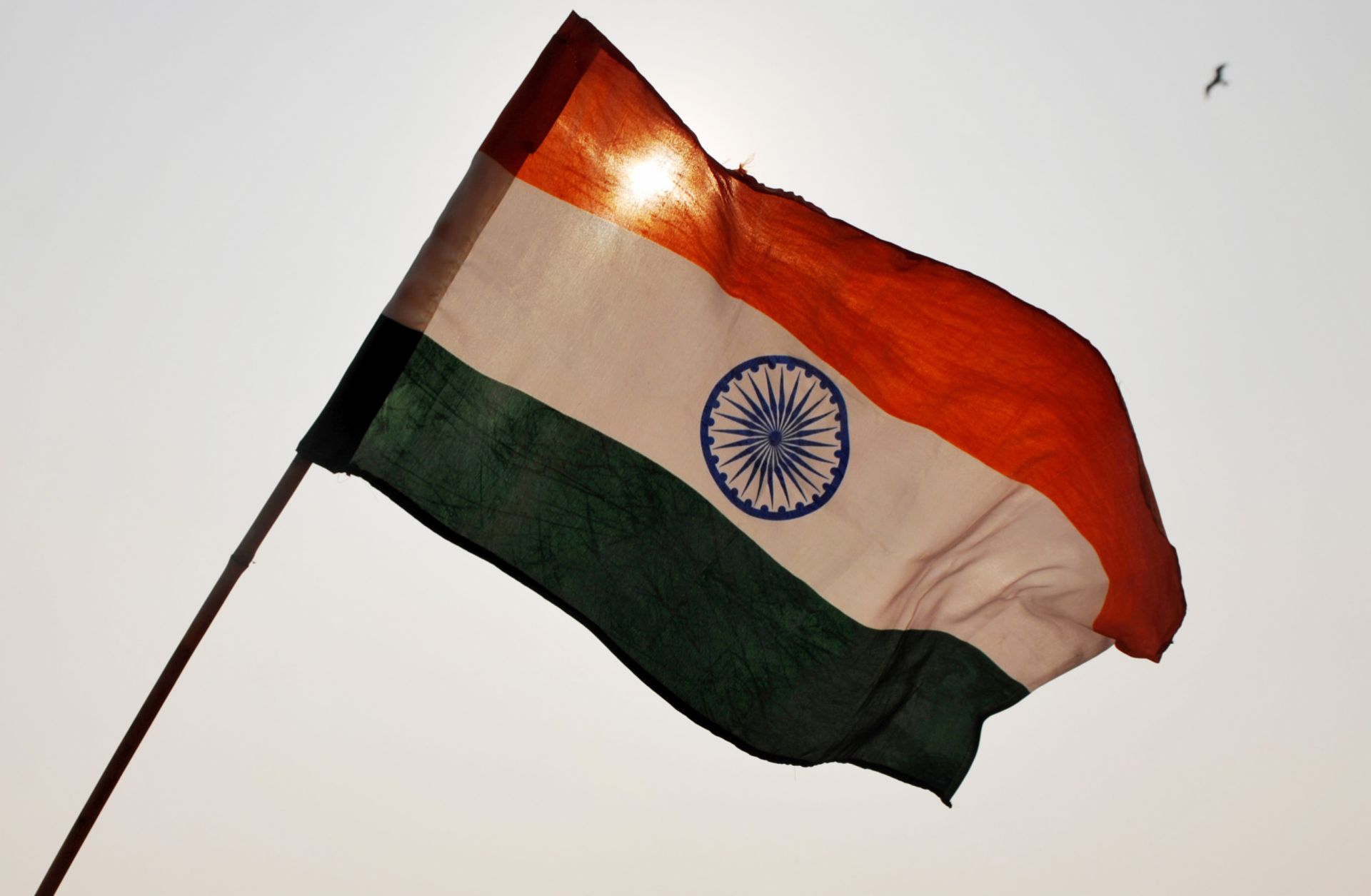 India’s national flag waves above a rally in New Delhi. 