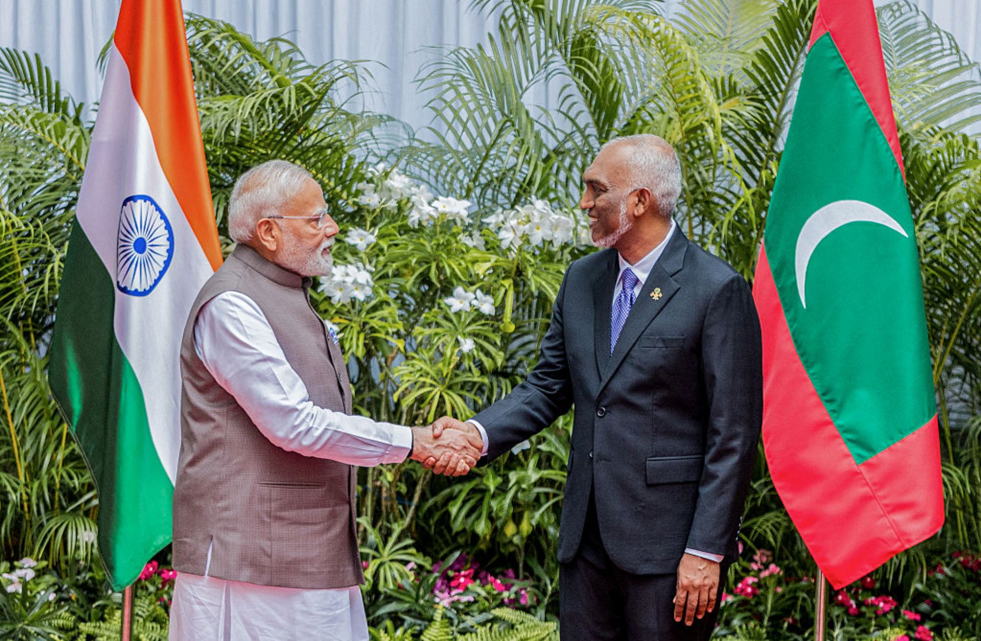 Indian Prime Minister Narendra Modi (left) shakes hands with Maldivian President Mohamed Muizzu upon meeting in Male on July 25, 2025. 
