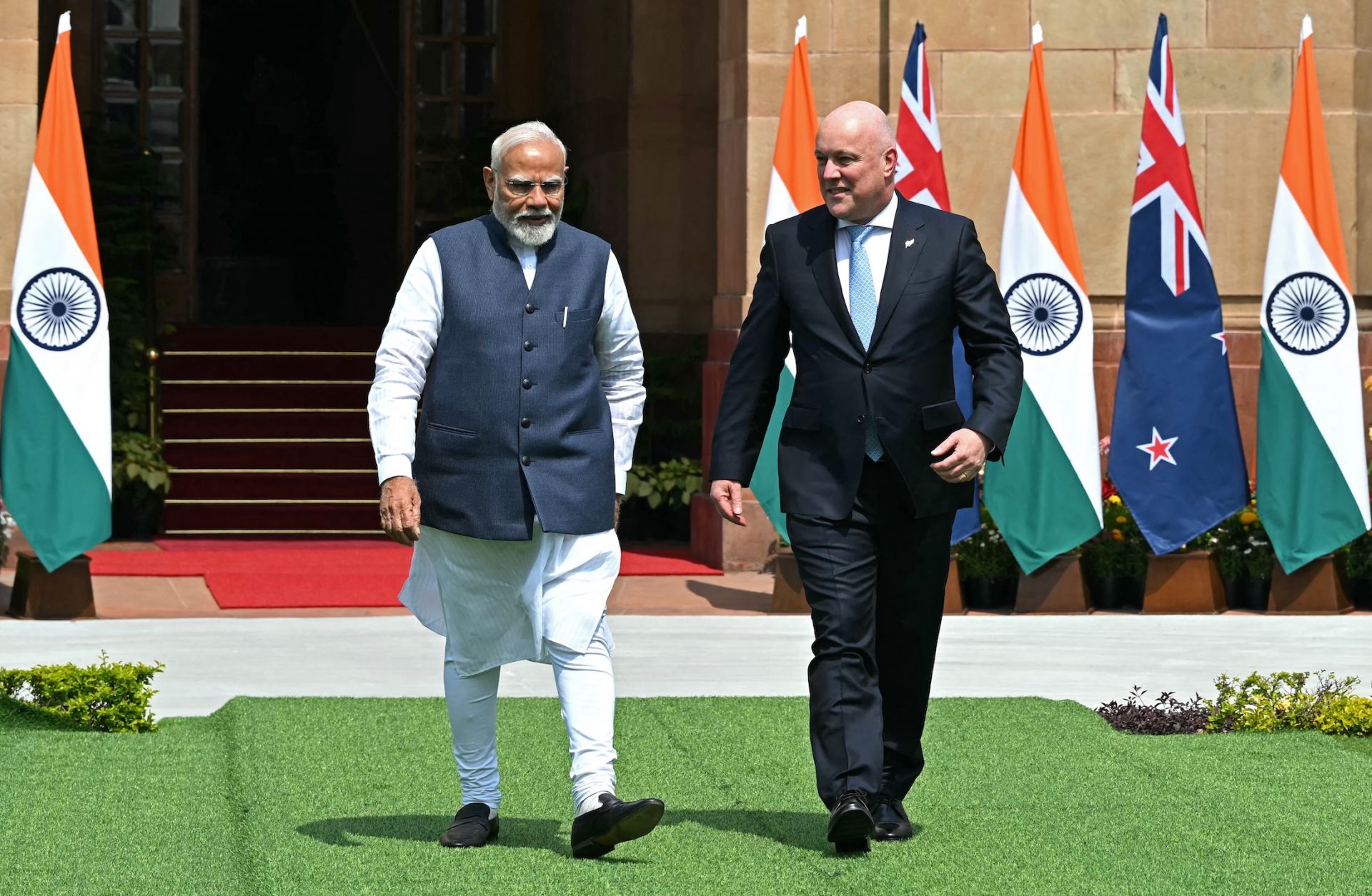 India's Prime Minister Narendra Modi (L) walks with New Zealand's Prime Minister Christopher Luxon (R) before their meeting at the Hyderabad House in New Delhi, India, on March 17, 2025. 