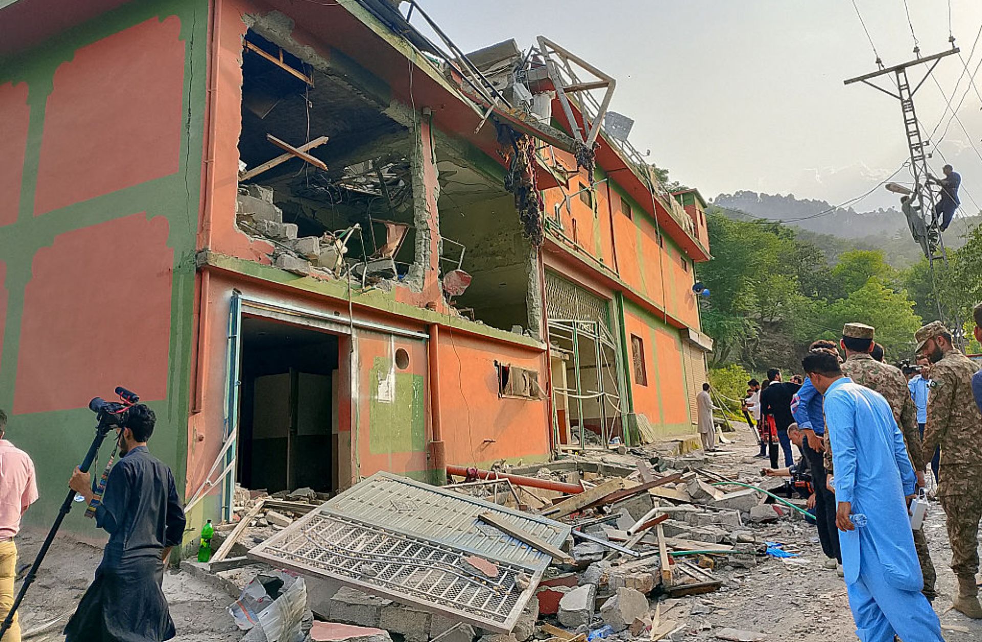 Soldiers and onlookers inspect the debris of a mosque damaged by Indian strikes in Muzaffarabad, the capital of Pakistan-administered Kashmir, on May 7, 2025. Soldiers and onlookers inspect the debris of a mosque damaged by Indian strikes in Muzaffarabad, the capital of Pakistan-administered Kashmir, on May 7, 2025.