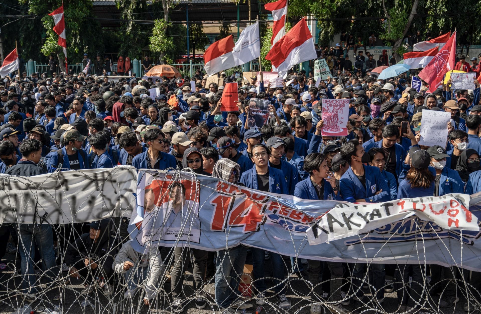 People gather in front of the East Java Provincial Parliament in Surabaya, Indonesia, on Aug. 23, 2024, as they protest against a move to overturn a Constitutional Court decision on election rules. 