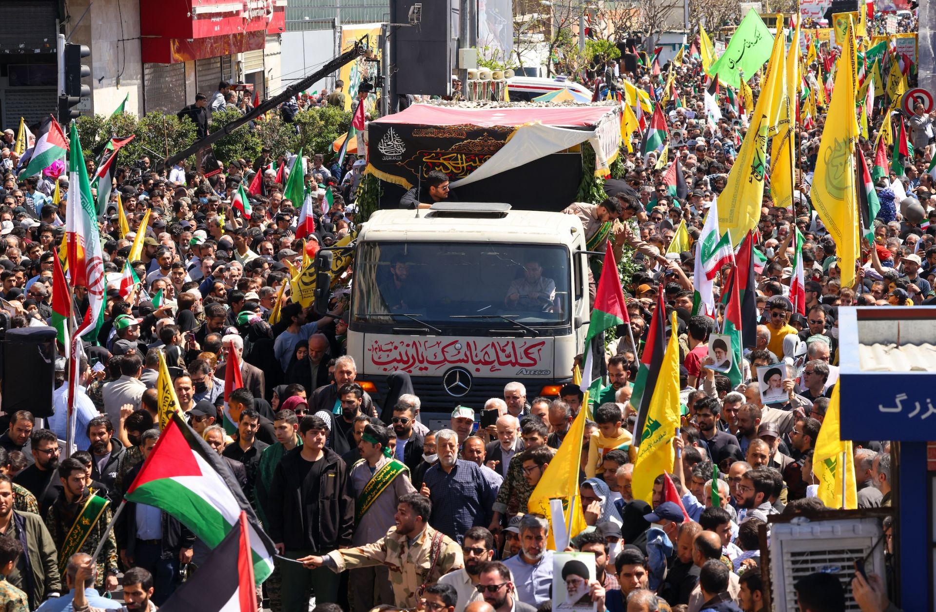 People attend an April 5, 2024, funeral procession for seven Islamic Revolutionary Guard Corps members killed in an Israeli strike in Syria.