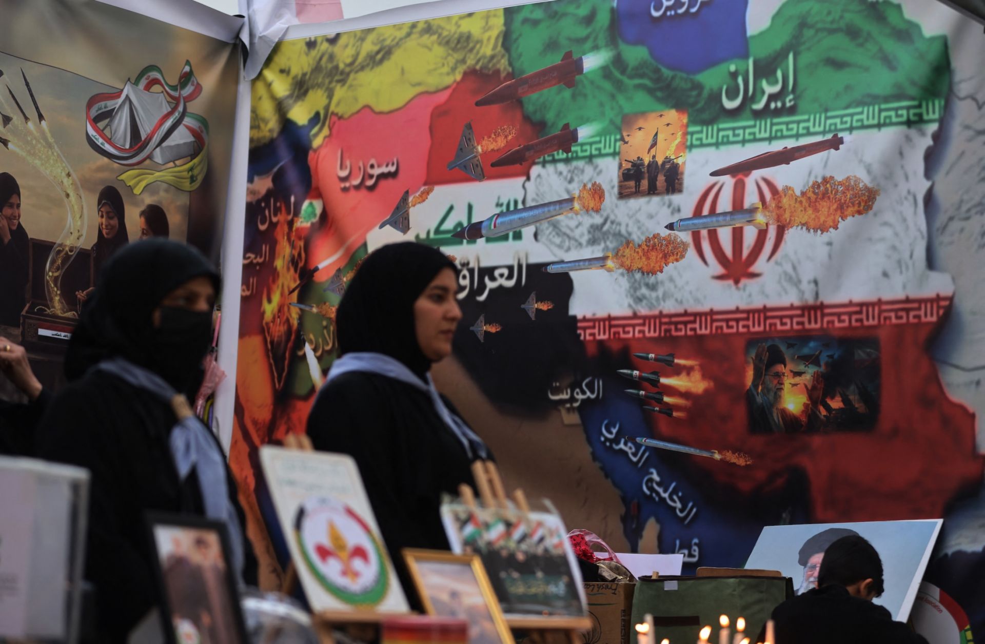 Iraqi women light candles in memory of the victims of the U.S.-Israeli attacks on Iran and Lebanon during a rally in Baghdad's Tahrir Square on April 2, 2026.