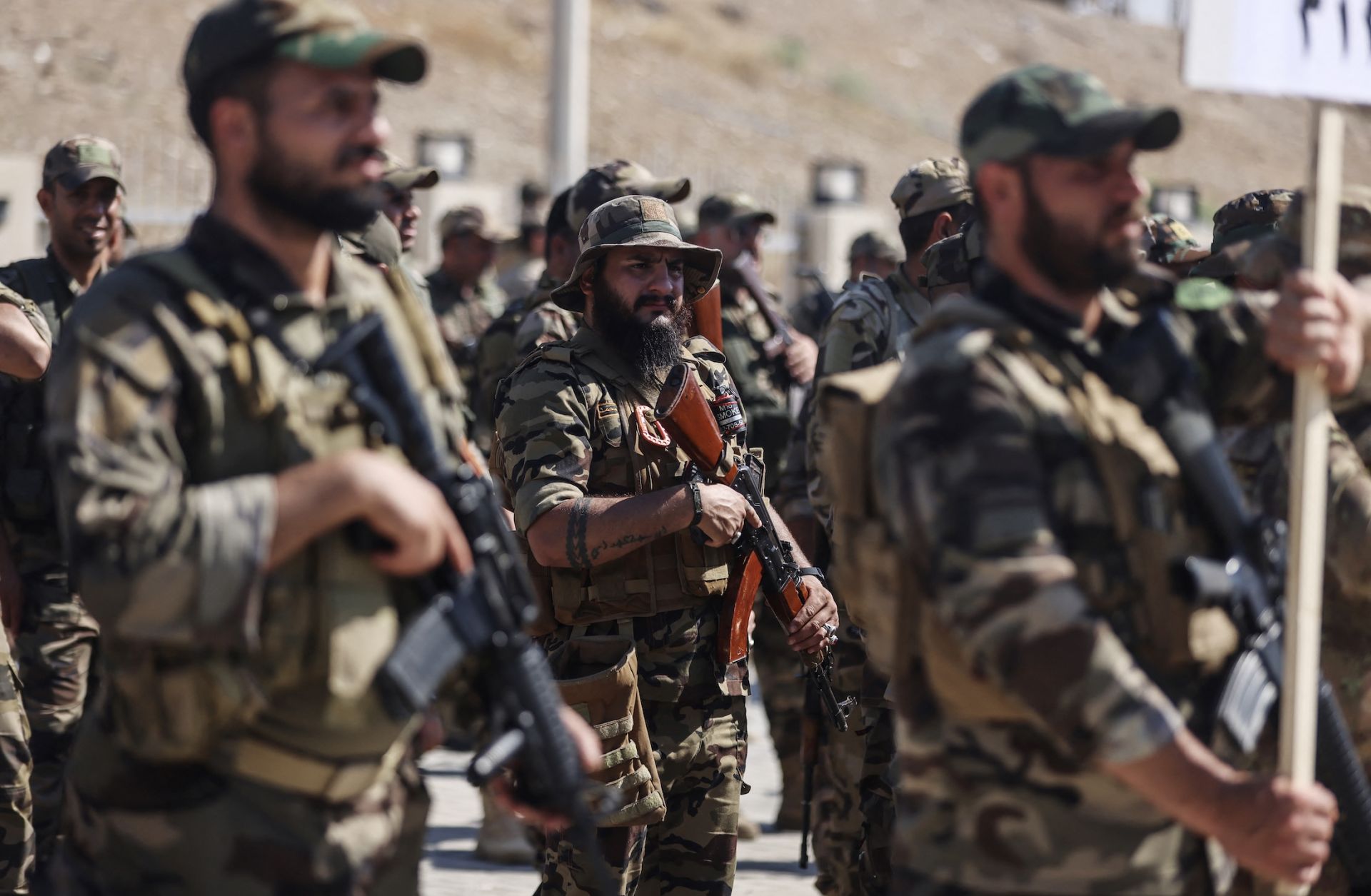Members of Saraya al-Salam gather during a ceremony in the city of Samarra on June 4, 2026, marking their separation from the Sadrist movement and their integration into the Iraqi security forces.