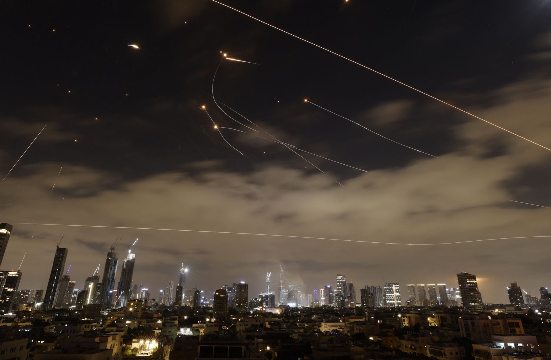 Israeli air defence systems are activated to intercept Iranian missiles over the Israeli city of Tel Aviv amid a fresh barrage of Iranian rockets on June 16, 2025. Israeli air defence systems are activated to intercept Iranian missiles over the Israeli city of Tel Aviv amid a fresh barrage of Iranian rockets on June 16, 2025.