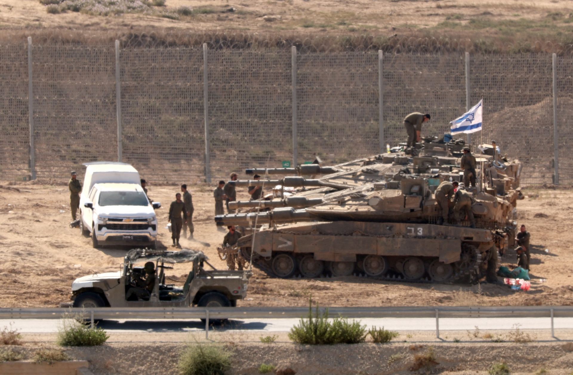 Israeli troops are seen deployed at the border with the Gaza Strip on July 23, 2025.