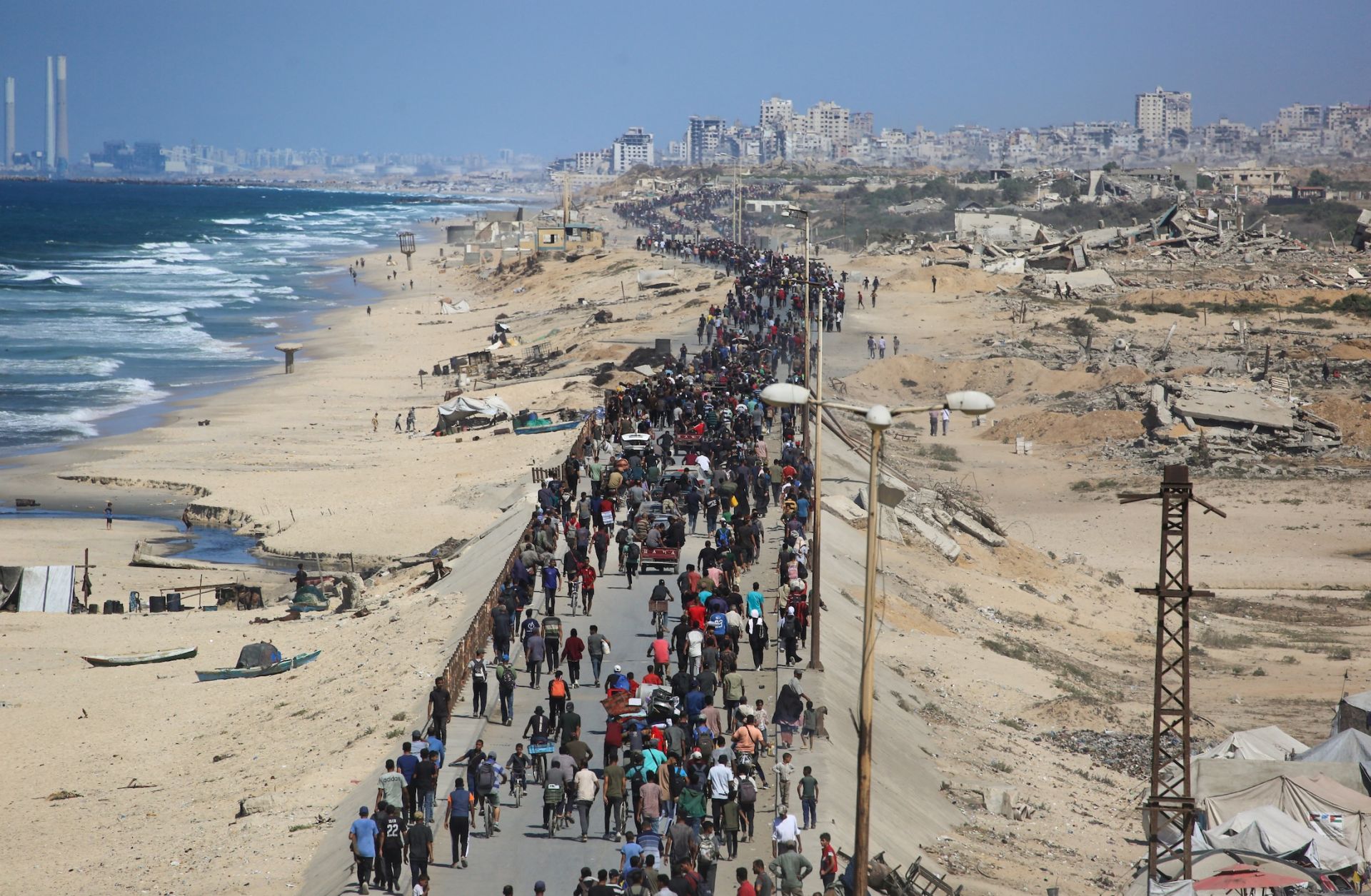 Palestinians on Oct. 10 on Al-Rashid road headed toward Gaza City.