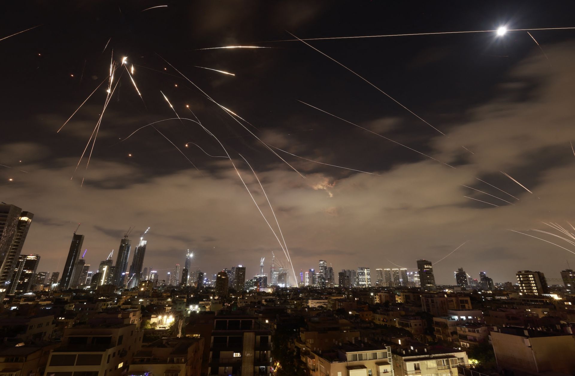 Israeli air defense systems intercept Iranian missiles over Tel Aviv amid a fresh barrage of Iranian rockets on June 16, 2025. Israeli air defense systems intercept Iranian missiles over Tel Aviv amid a fresh barrage of Iranian rockets on June 16, 2025. 