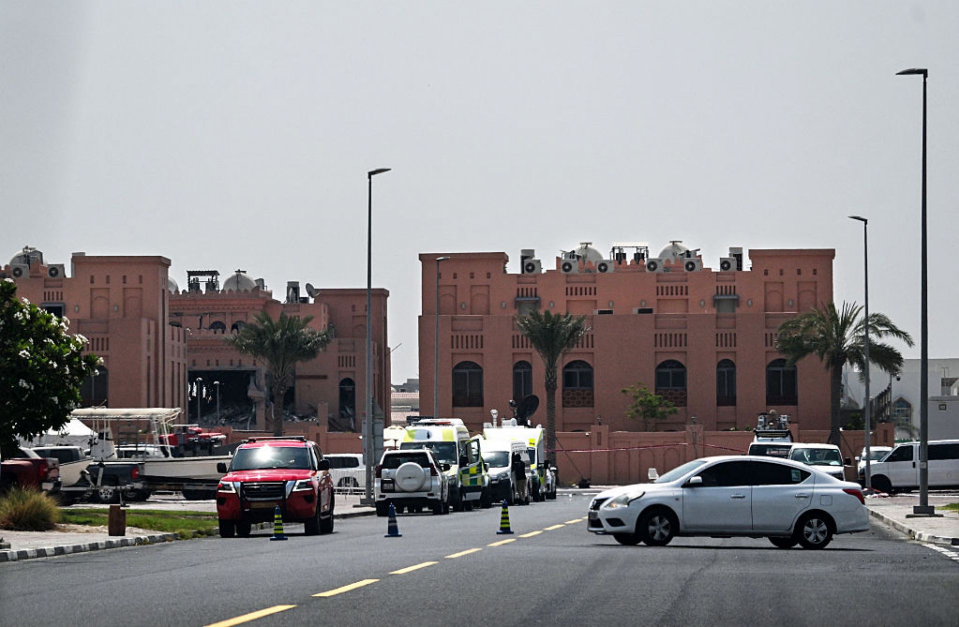 A picture taken from a distance shows the damaged building (L) in the Qatari compound housing members of Hamas' political bureau on Sept. 10, 2025. Israel targeted the building the previous day in a strike in Qatar's capital, Doha. A picture taken from a distance shows the damaged building (L) in the Qatari compound housing members of Hamas' political bureau on Sept. 10, 2025. Israel targeted the building the previous day in a strike in Qatar's capital, Doha.