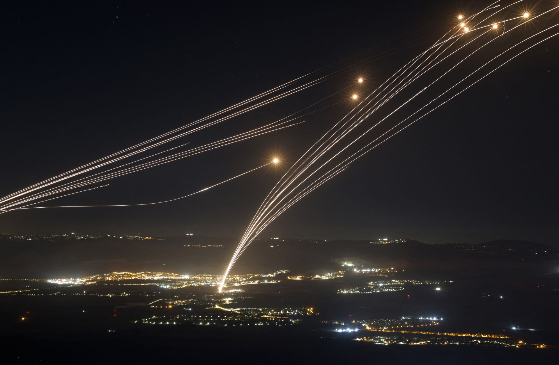 Israel's Iron Dome air defense system intercepts rockets fired from southern Lebanon on Aug. 4, 2024, in the Upper Galilee region of northern Israel.