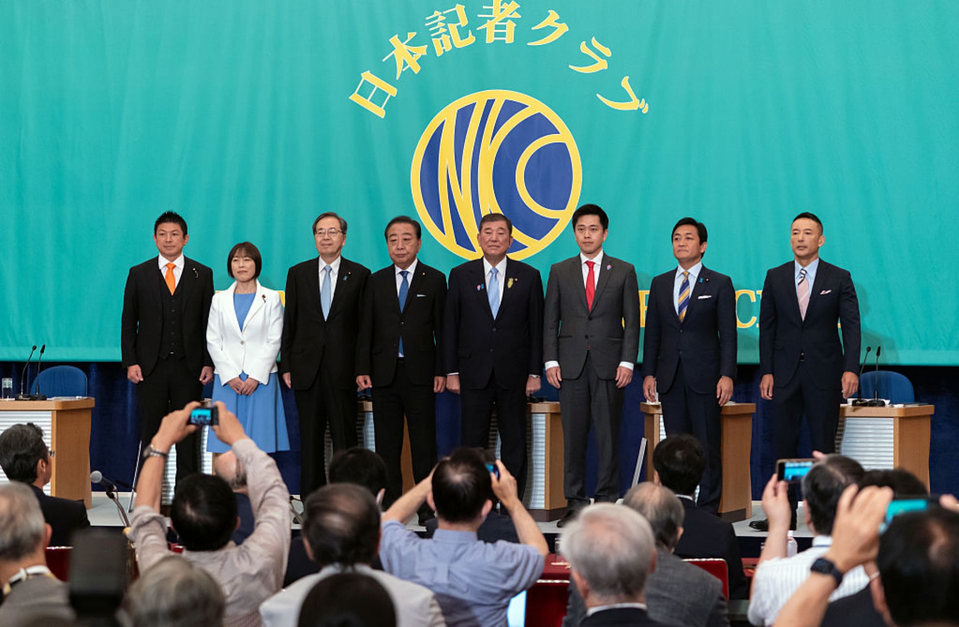 Leaders of eight political parties pose before a debate at the Japan National Press Club on July 2, 2025, in Tokyo, Japan. From left to right are Sanseito Secretary General Sohei Kamiya, Japanese Communist Party Chairperson Tomoko Tamura, Komeito Chief Representative Tetsuo Saito, Constitutional Democratic Party President Yoshihiko Noda, Japan's Prime Minister and Liberal Democratic Party President Shigeru Ishiba, Governor of Osaka and Japan Innovation Party Co-Representative Hirofumi Yoshimura, Democratic 