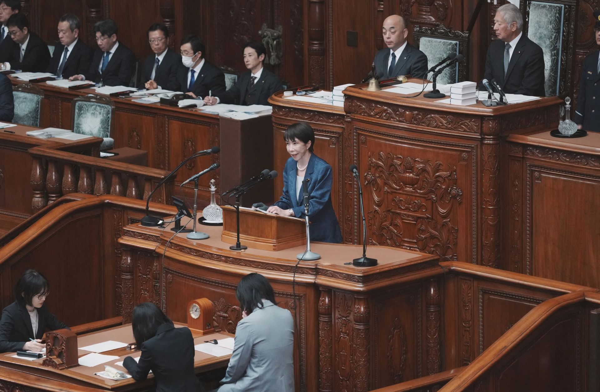 Japanese Prime Minister Sanae Takaichi (C) answers questions during a plenary session of the House of Representatives at Parliament on March 26 in Tokyo.