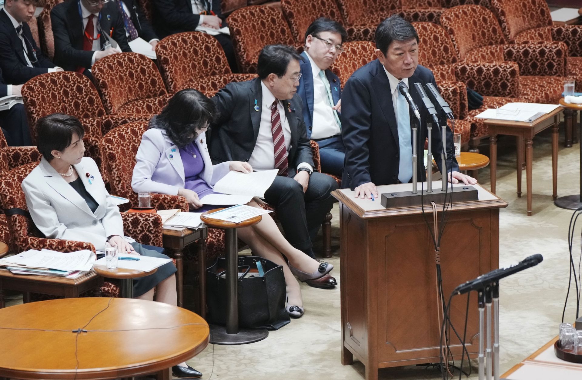 Japanese Foreign Minister Toshimitsu Motegi answers questions at a legislative budget committee session in Tokyo on April 7, 2026, while Prime Minister Sanae Takaichi (left) looks on. Japanese Foreign Minister Toshimitsu Motegi answers questions at a legislative budget committee session in Tokyo on April 7, 2026, while Prime Minister Sanae Takaichi (left) looks on.