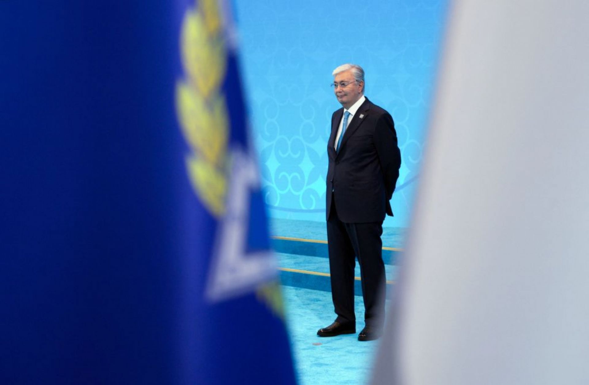 In this pool photograph distributed by the Russian state agency Sputnik, Kazakh President Kassym-Jomart Tokayev waits to greet foreign leaders during the Shanghai Cooperation Organization member states leaders' summit in Astana on July 4, 2024. In this pool photograph distributed by the Russian state agency Sputnik, Kazakh President Kassym-Jomart Tokayev waits to greet foreign leaders during the Shanghai Cooperation Organization member states leaders' summit in Astana on July 4, 2024.