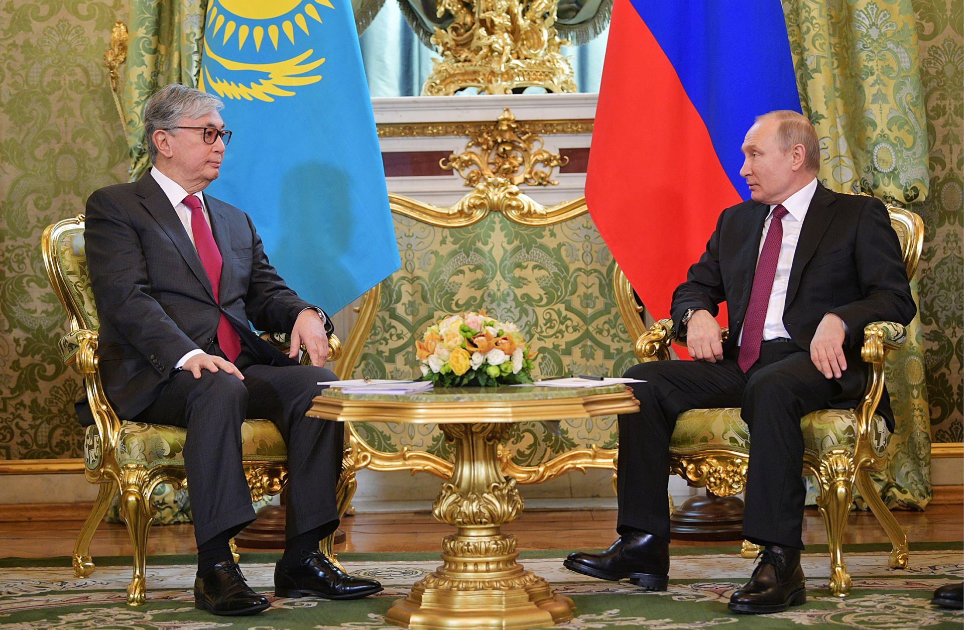Kazakhstan's acting President Kassym-Jomart Tokayev sits next to Russian President Vladimir Putin during a meeting at the Kremlin. 