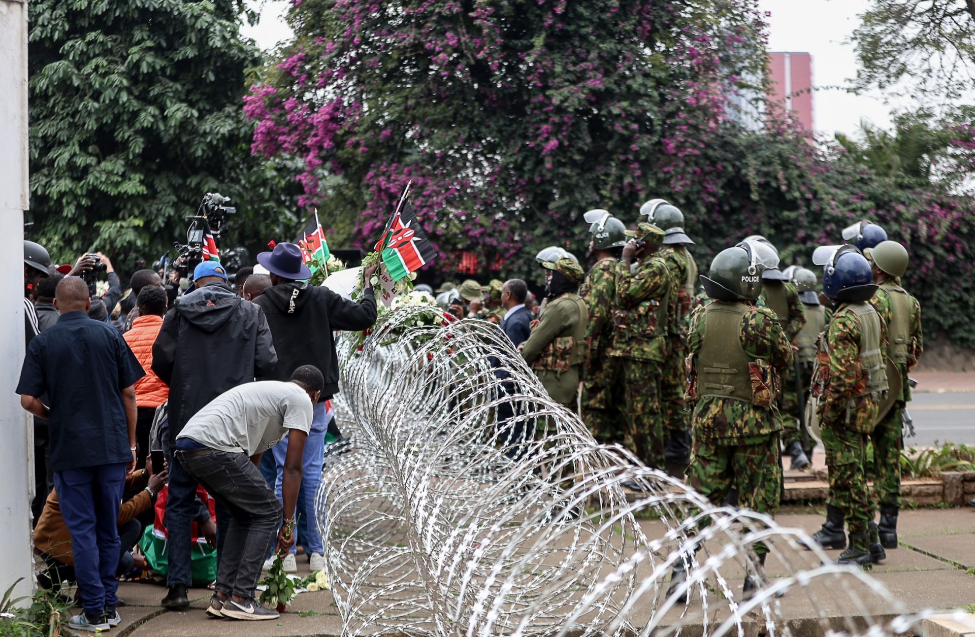 Protesters march outside Parliament to honor victims of the June 25, 2024, protest on June 25, 2026, in Nairobi, Kenya.