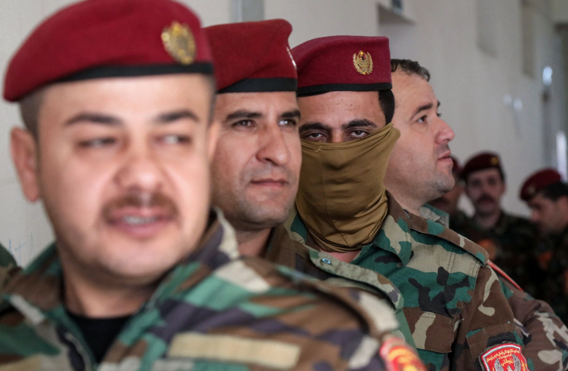 Members of the Kurdish peshmerga security forces queue at a polling station to vote ahead of the Oct. 20 parliamentary election in Arbil, the capital of Iraq's autonomous Kurdish region, on Oct. 18, 2024. 