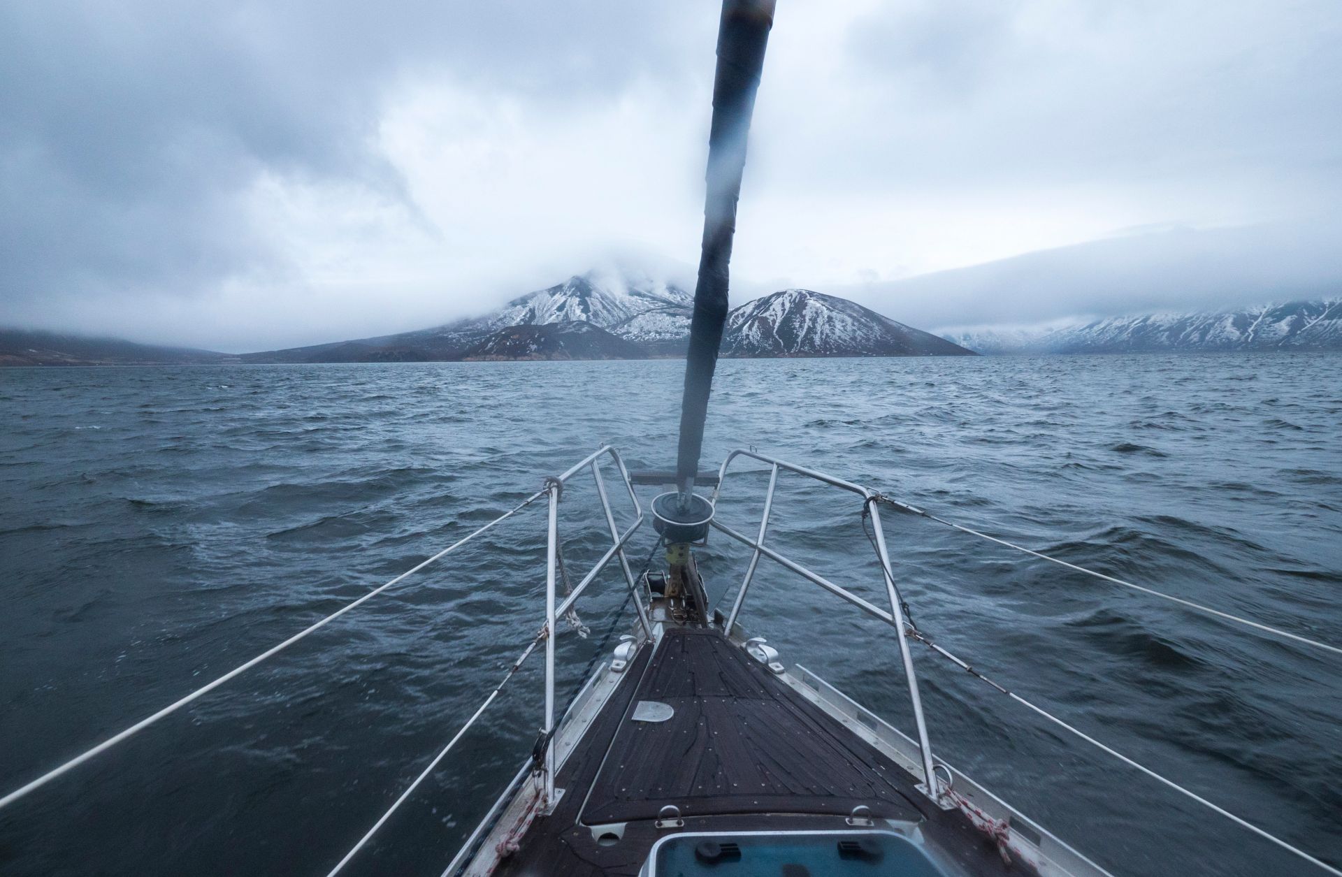 The Kuril Islands appear on the horizon as a boat approaches.