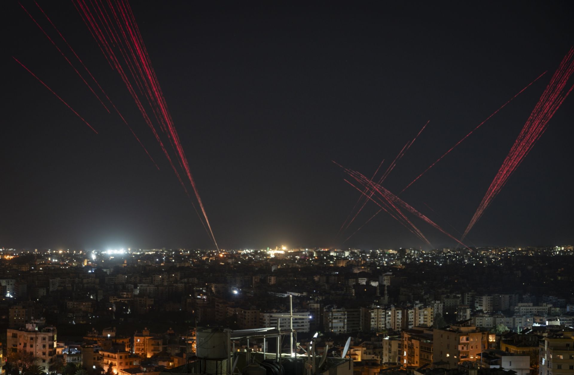 People in Beirut fire bullets into the sky to celebrate the new Lebanon-Israel ceasefire agreement on April 16, 2026. 