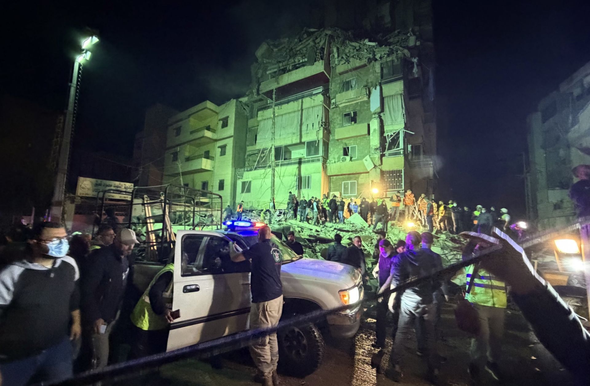 People gather at the site of an Israeli airstrike that targeted Beirut's southern suburbs on May 6, 2026.